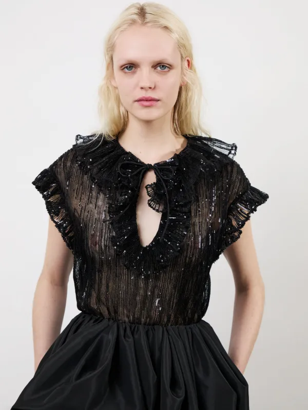 The Este ruffle top in black made by Aknvas