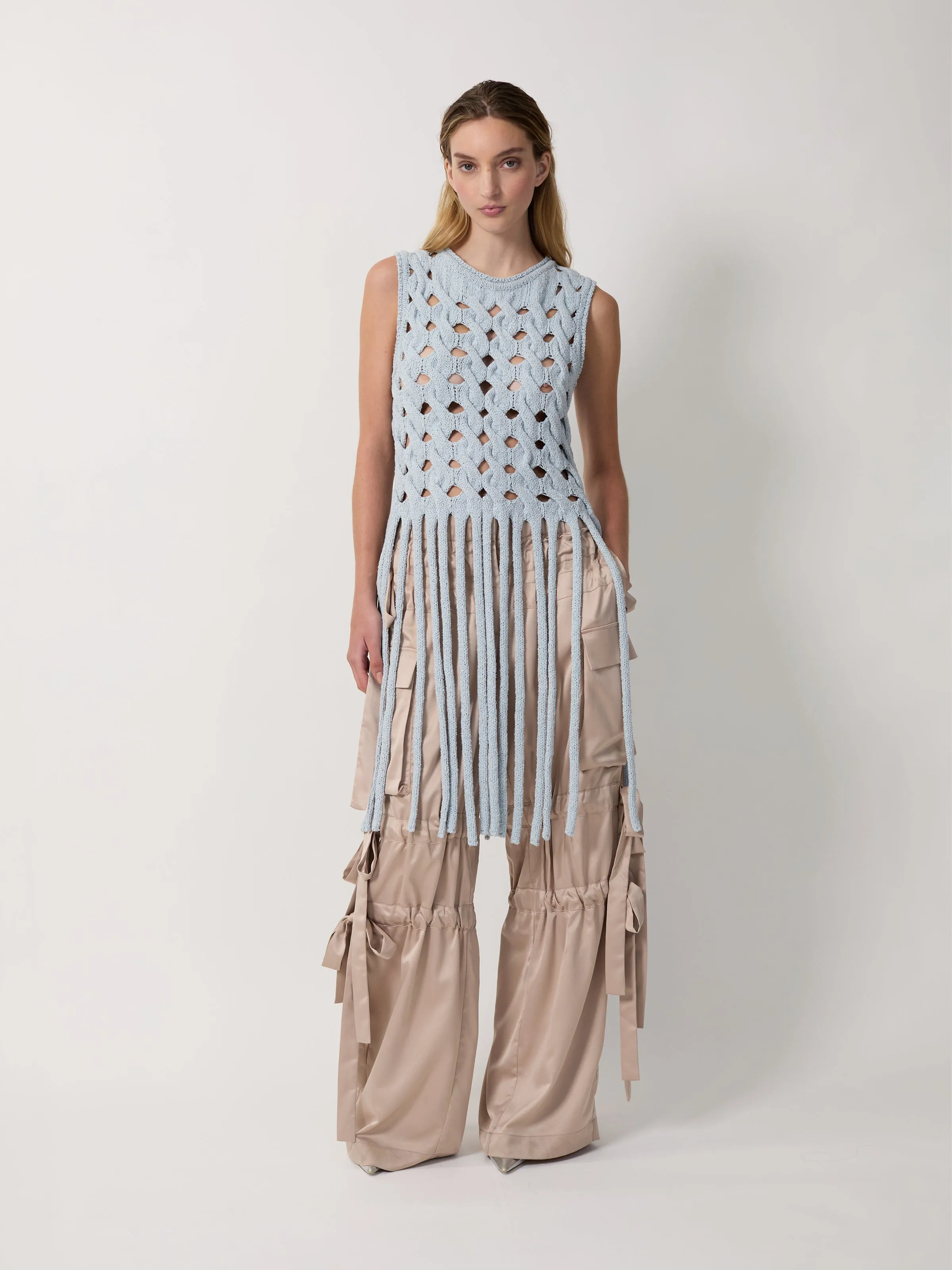 The Kiki fringe top sold by Aknvas