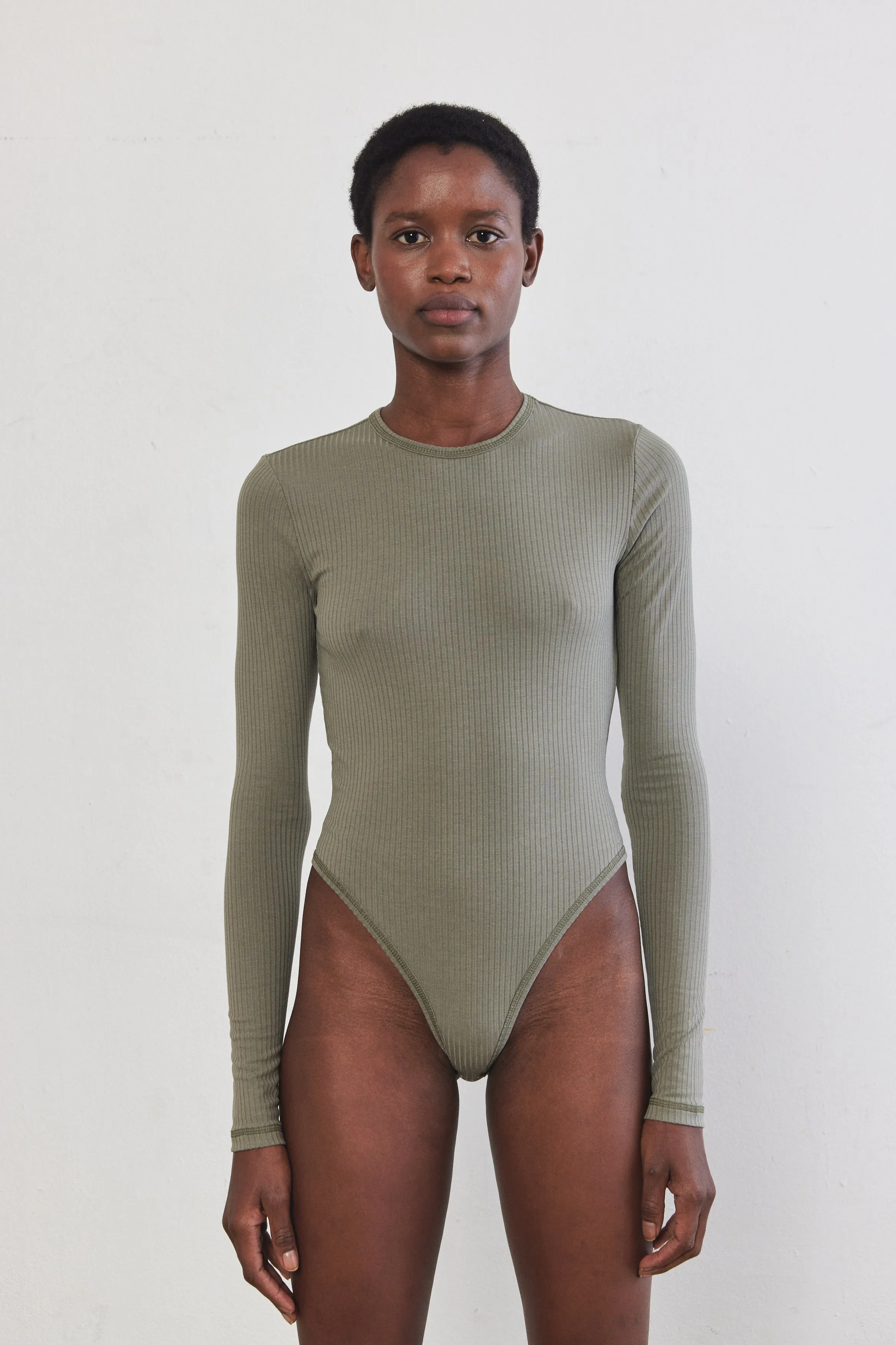 Open Back Ribbed Bodysuit sold by Dé Rococo