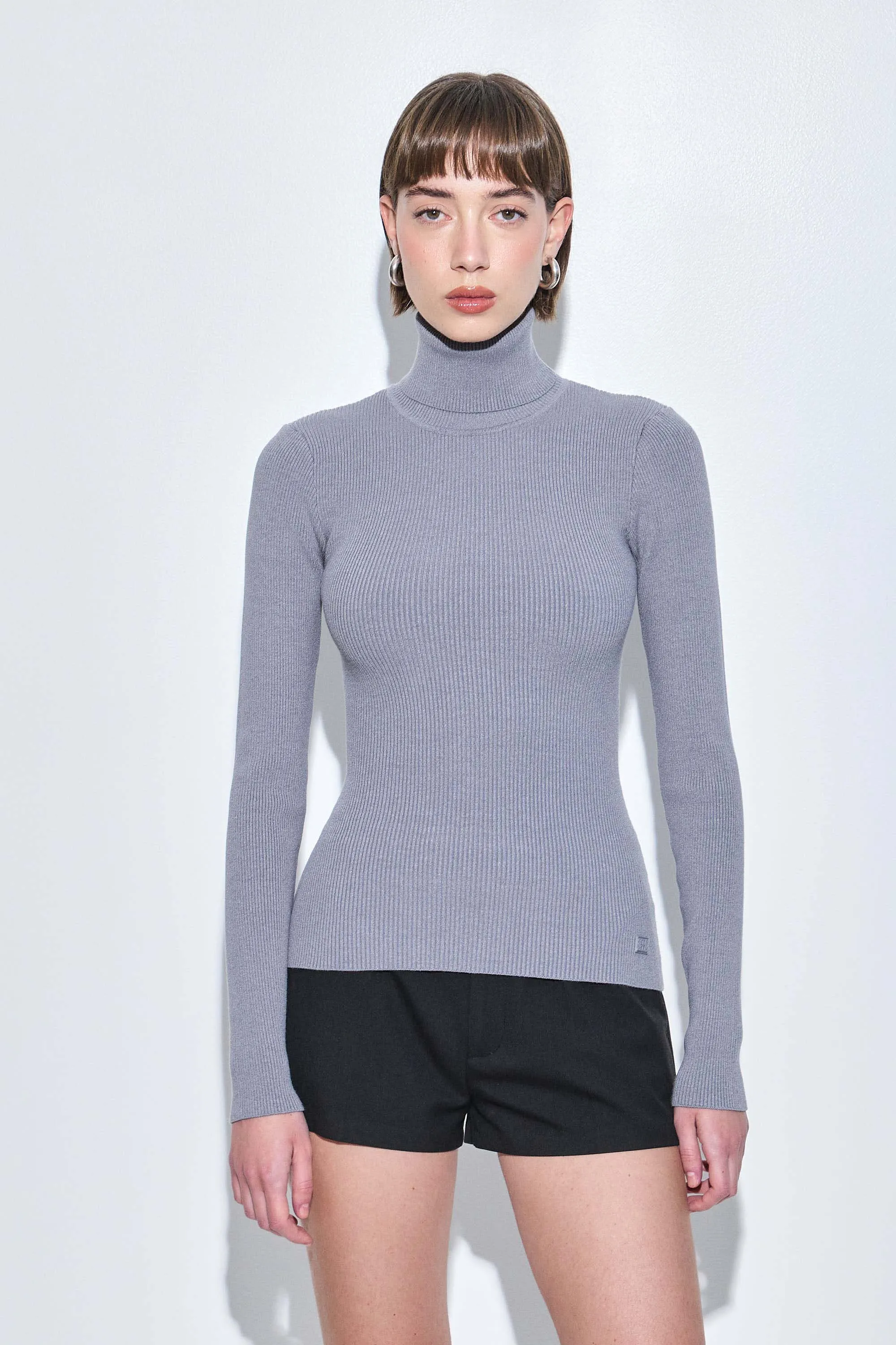 Ribbed Turtleneck Top sold by Dé Rococo