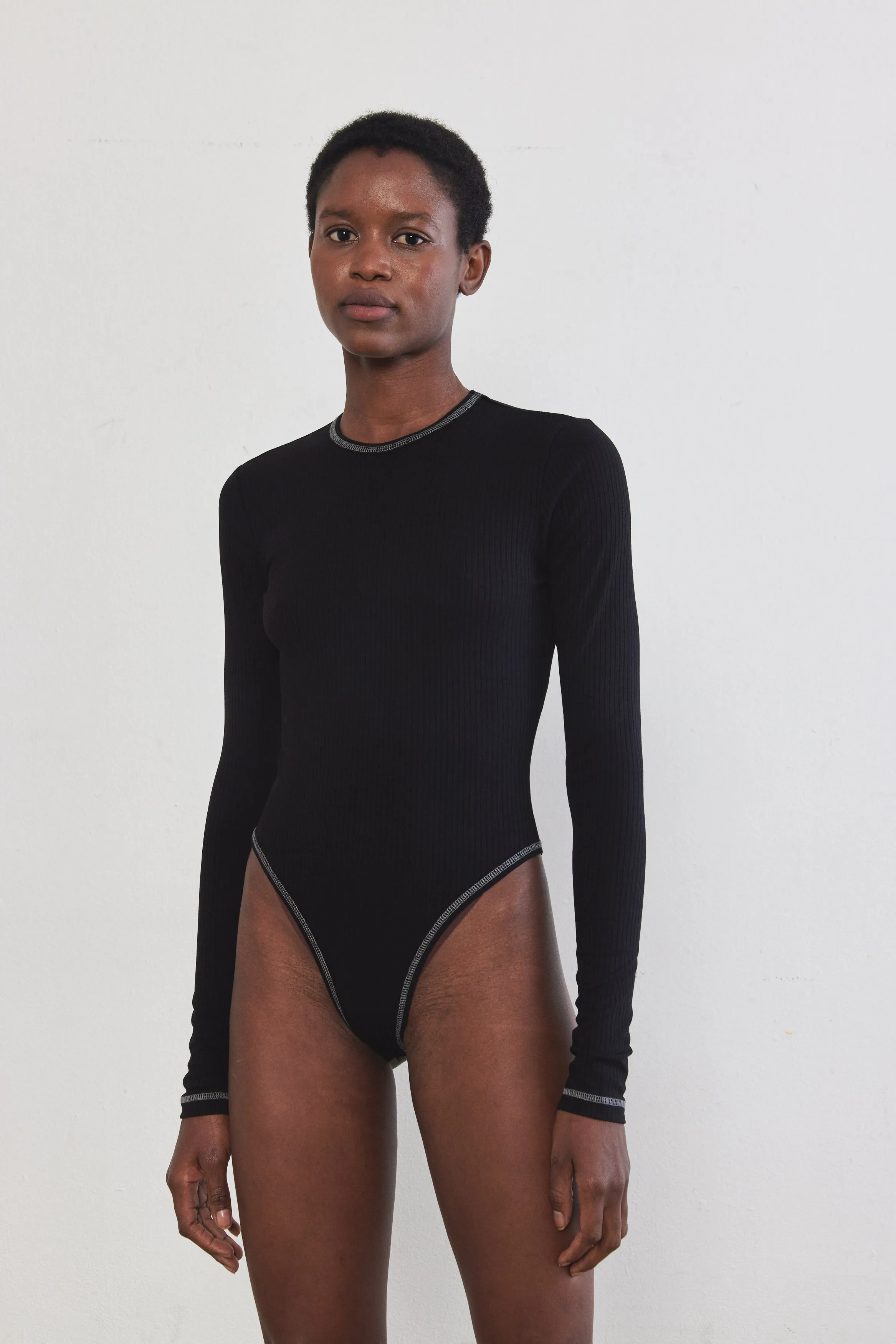 Open Back Ribbed Bodysuit sold by Dé Rococo