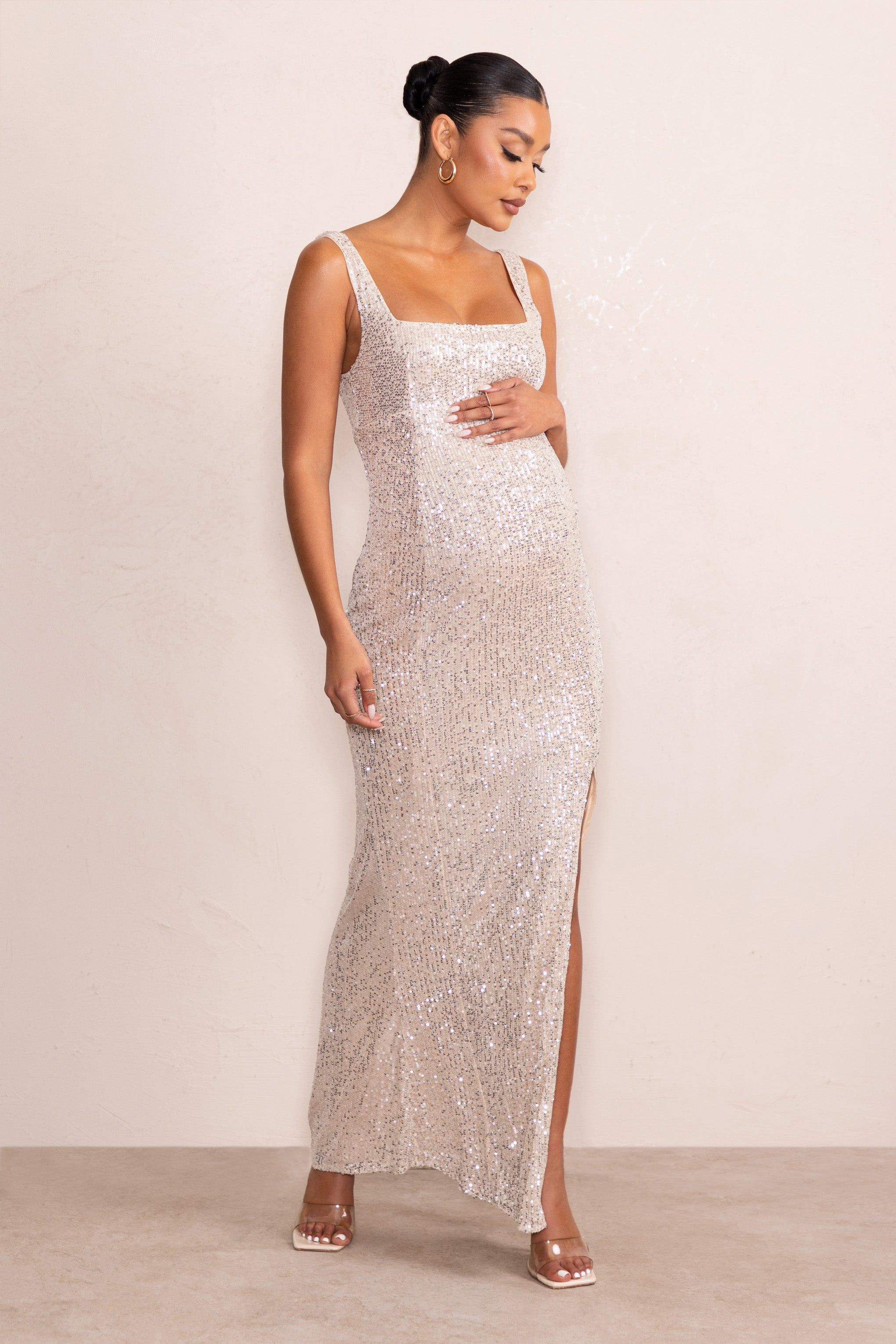 Sparkle Mama | Nude Maternity Sequin Split Hem Maxi Dress sold by Club L London