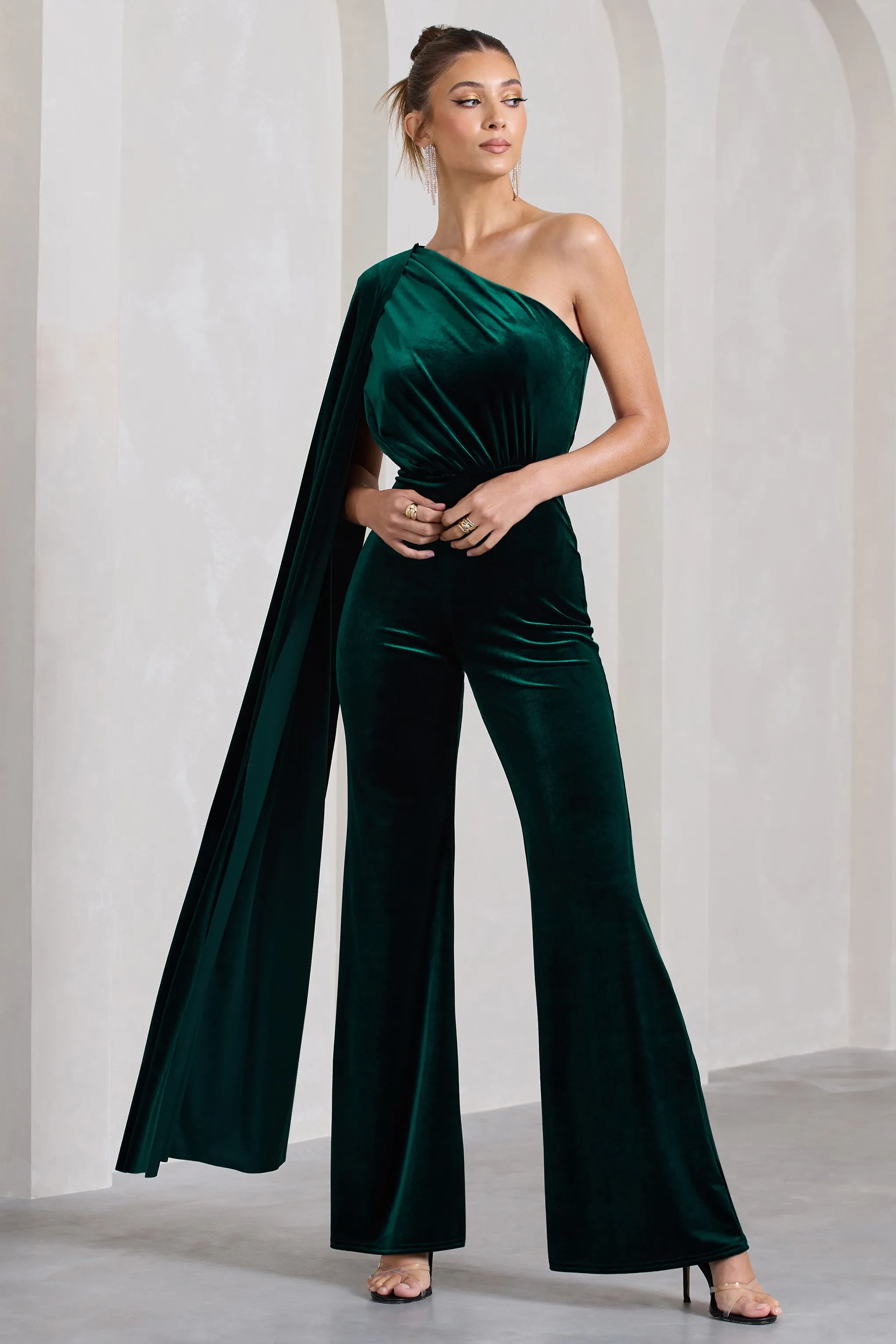 Aurora | Bottle Green Velvet One Shoulder Cape Sleeve Jumpsuit sold by Club L London