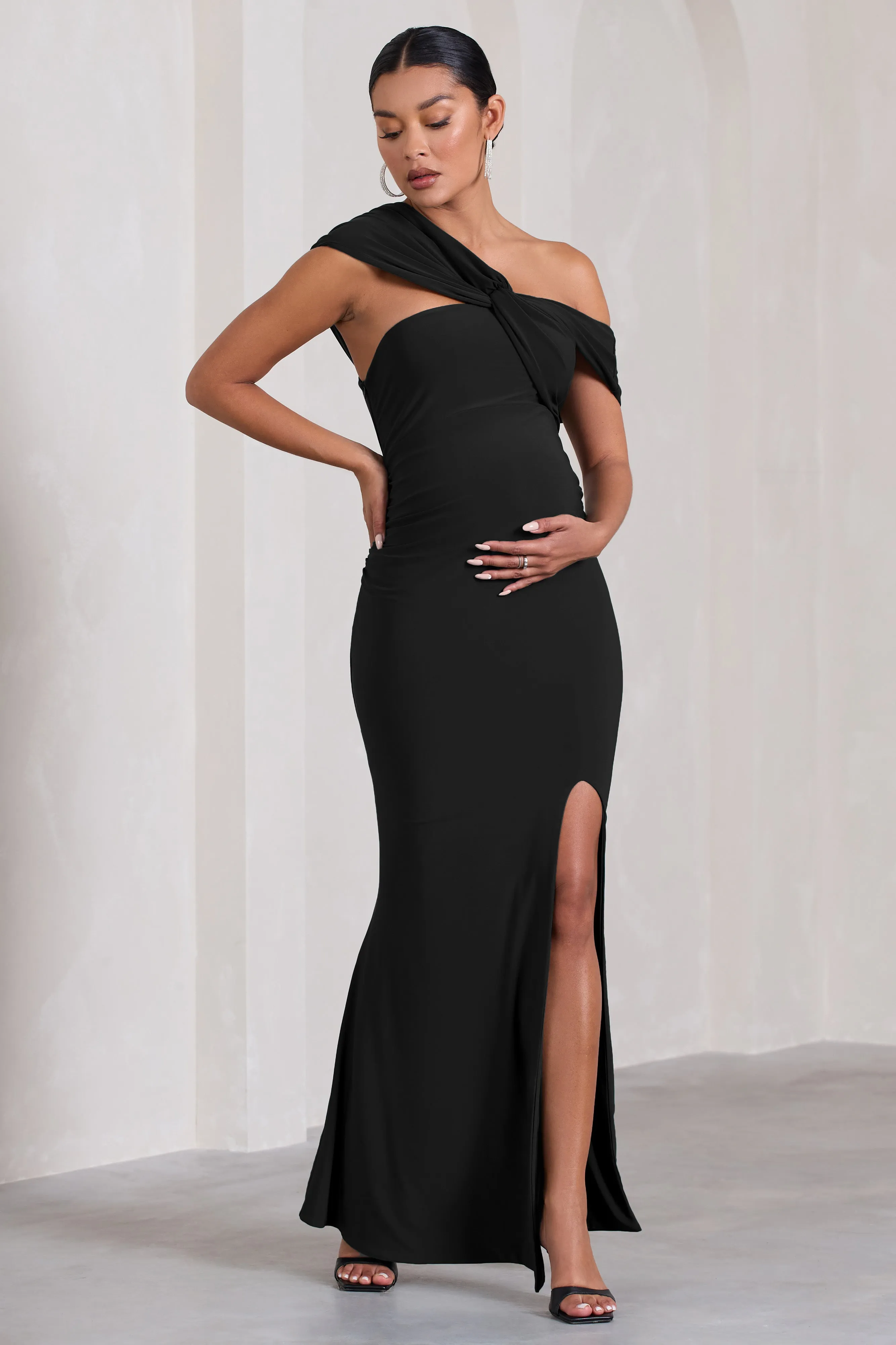 Kara | Black Asymmetric Twisted Bardot Split Maternity Maxi Dress sold by Club L London