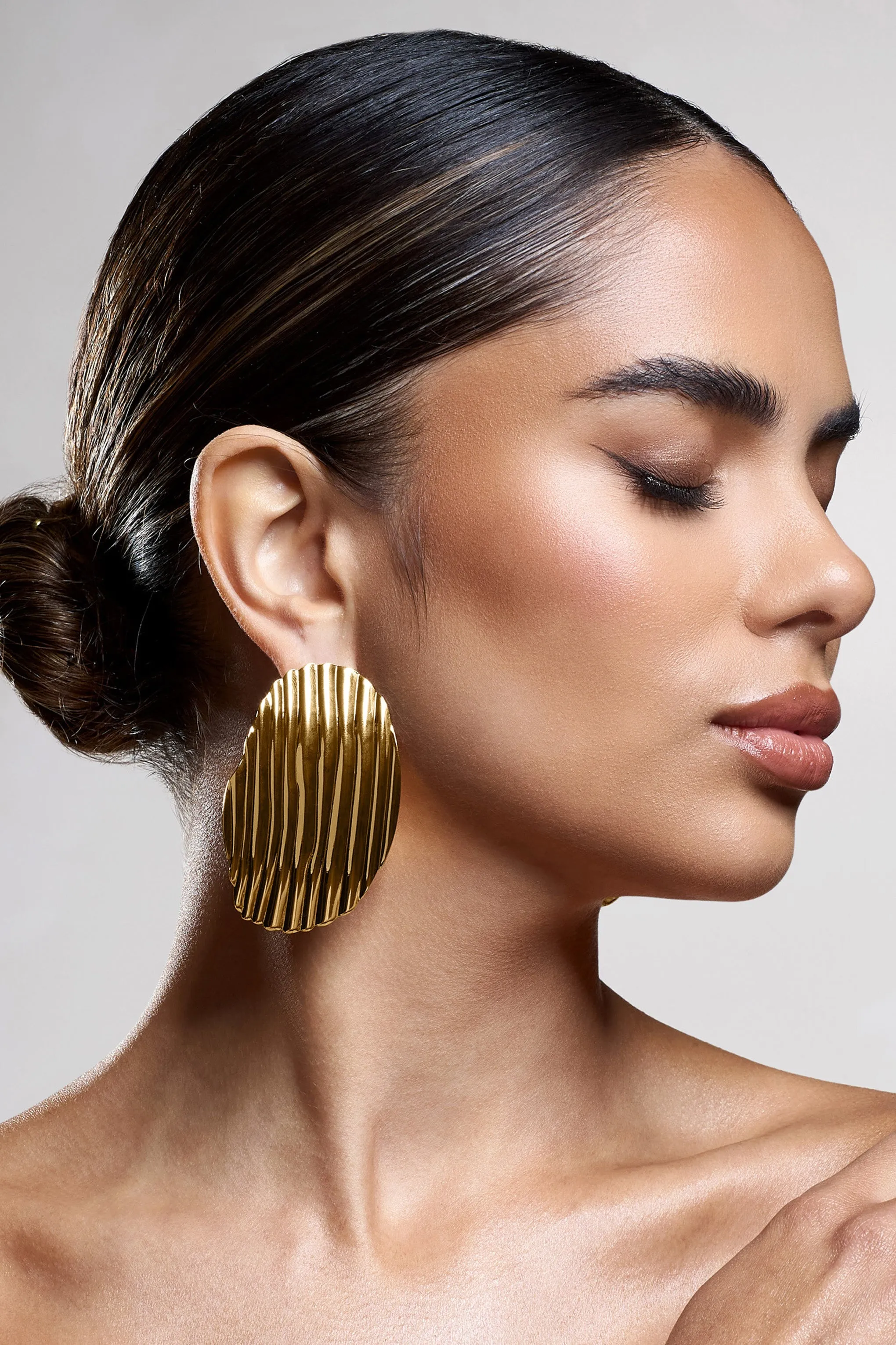 Sarla | Gold Textured Ribbed Statement Oval Earrings sold by Club L London product image thumbnail 2