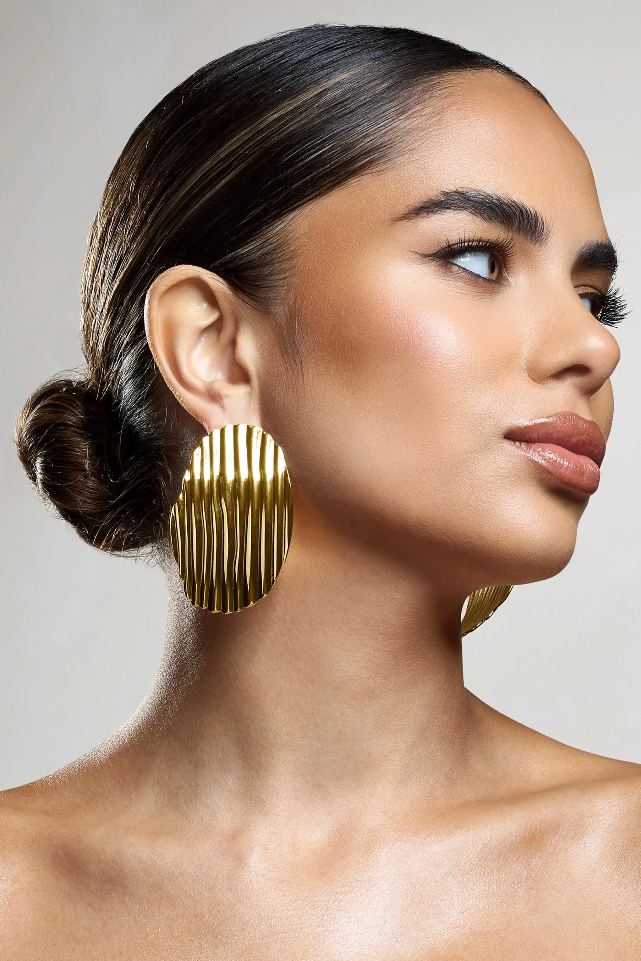 Sarla | Gold Textured Ribbed Statement Oval Earrings sold by Club L London product image thumbnail 3