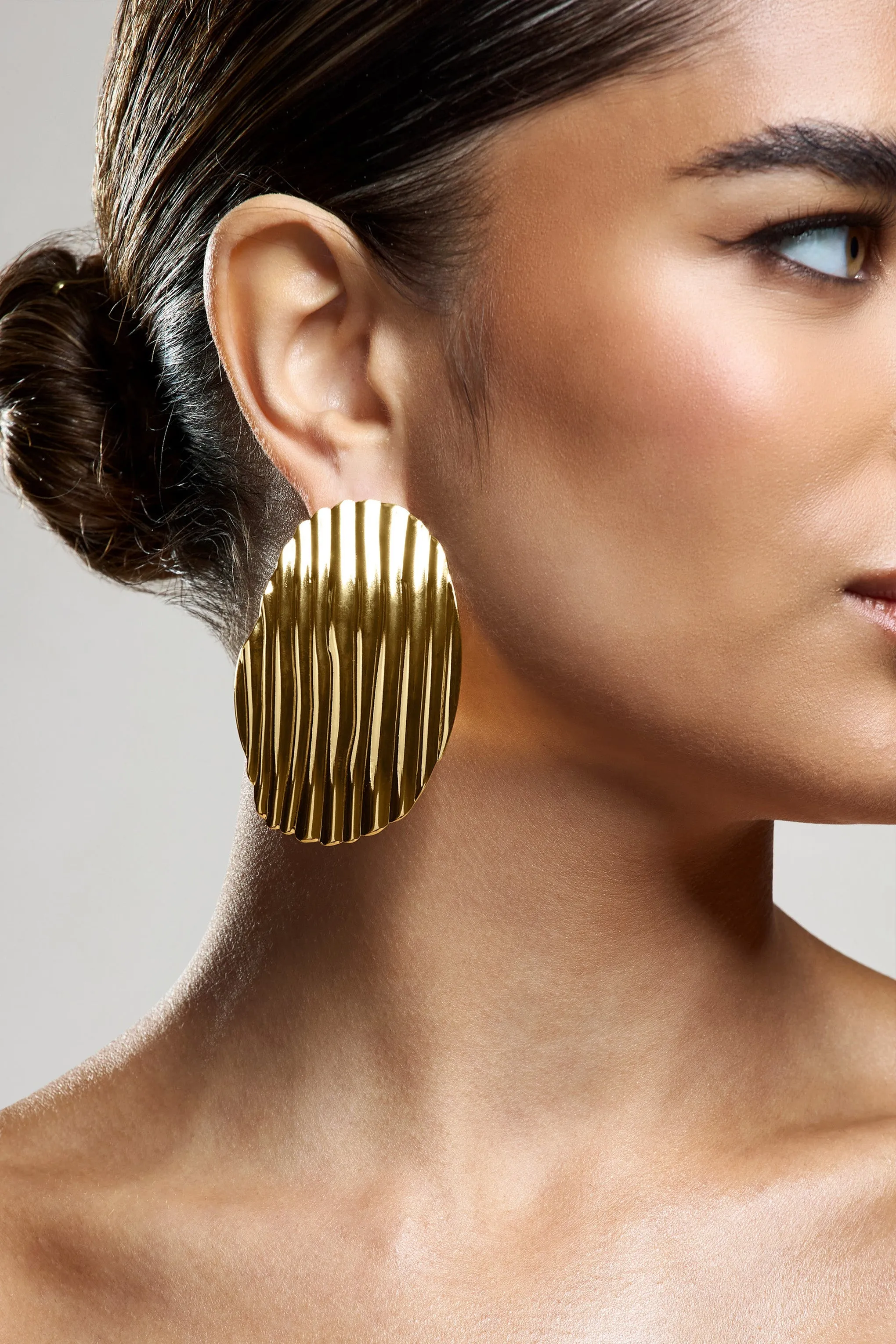 Sarla | Gold Textured Ribbed Statement Oval Earrings sold by Club L London product image thumbnail 4