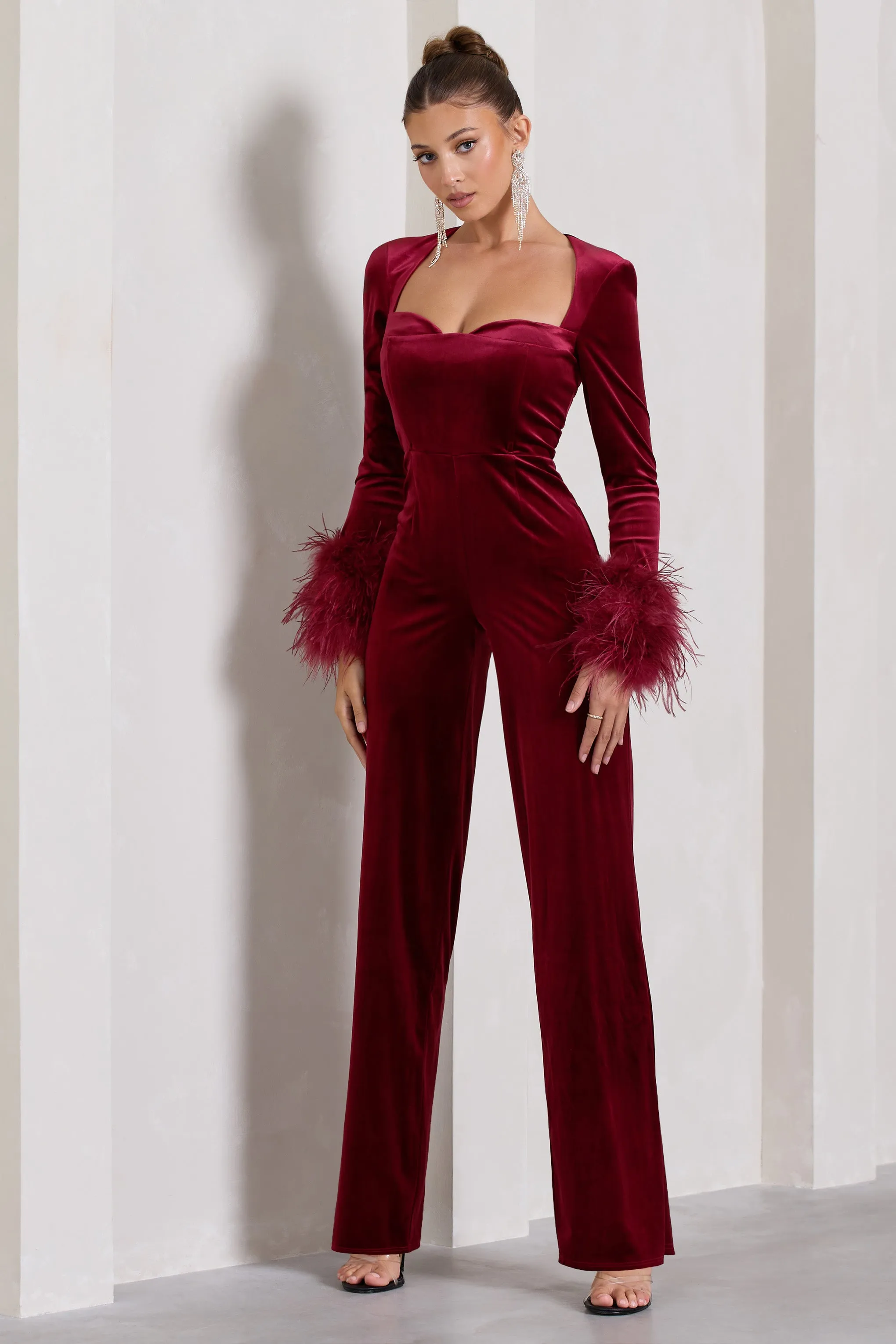 Trailblazer | Berry Red Velvet Long-Sleeved Jumpsuit With Feather Cuffs sold by Club L London
