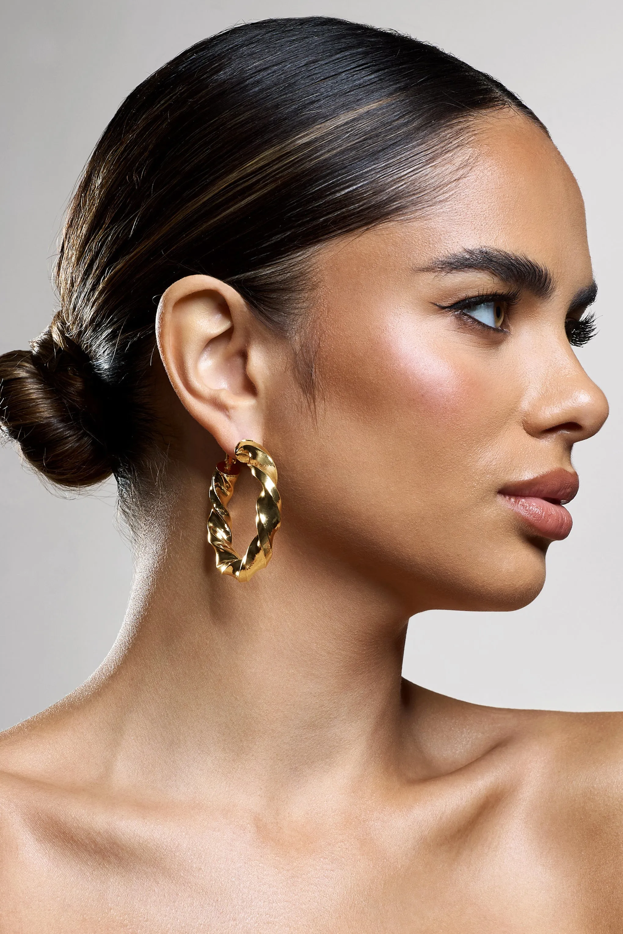 Lucid | Gold Chunky Twist Hoop Earrings sold by Club L London