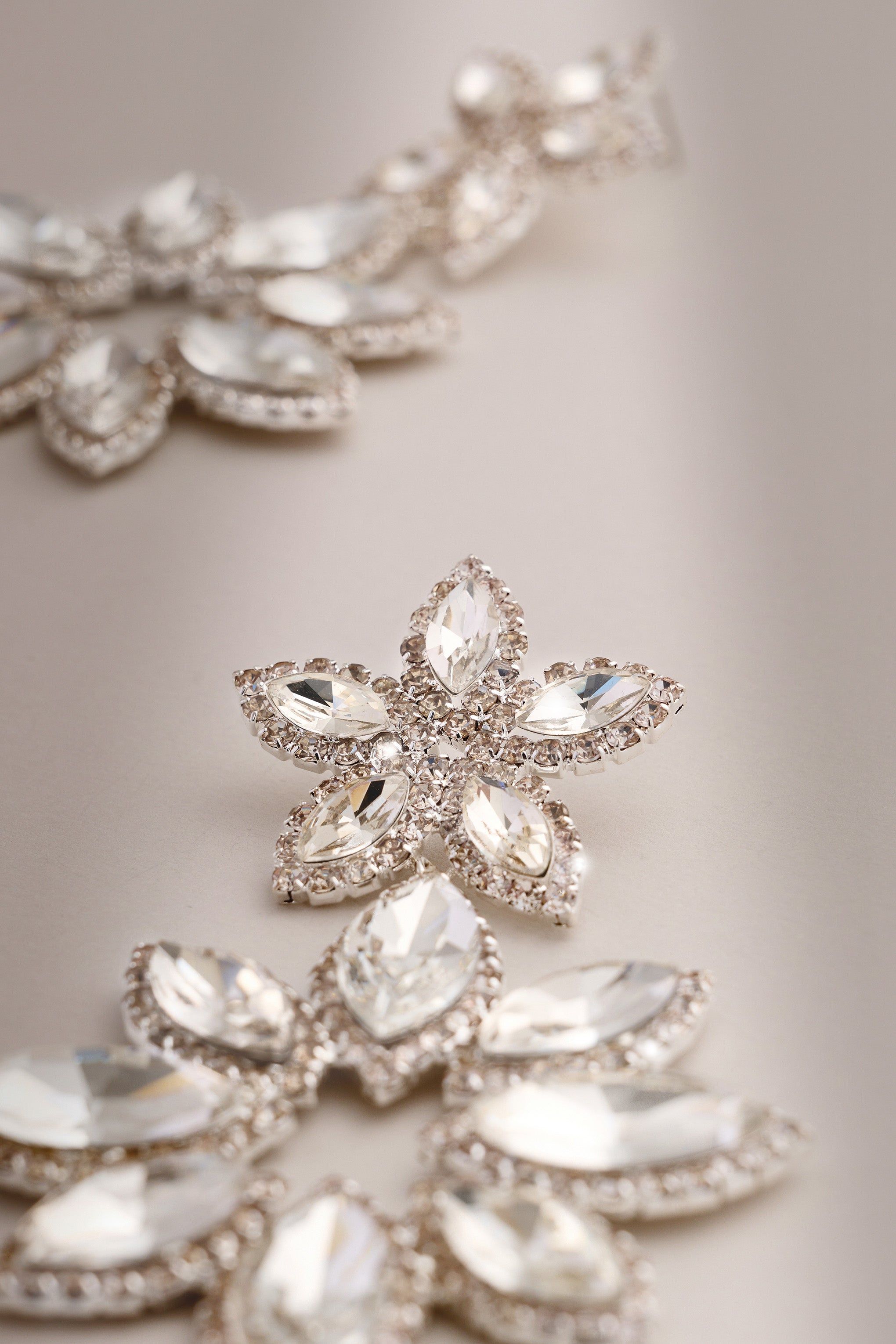 Maura | Silver Diamante Flower Statement Earrings sold by Club L London product image thumbnail 2