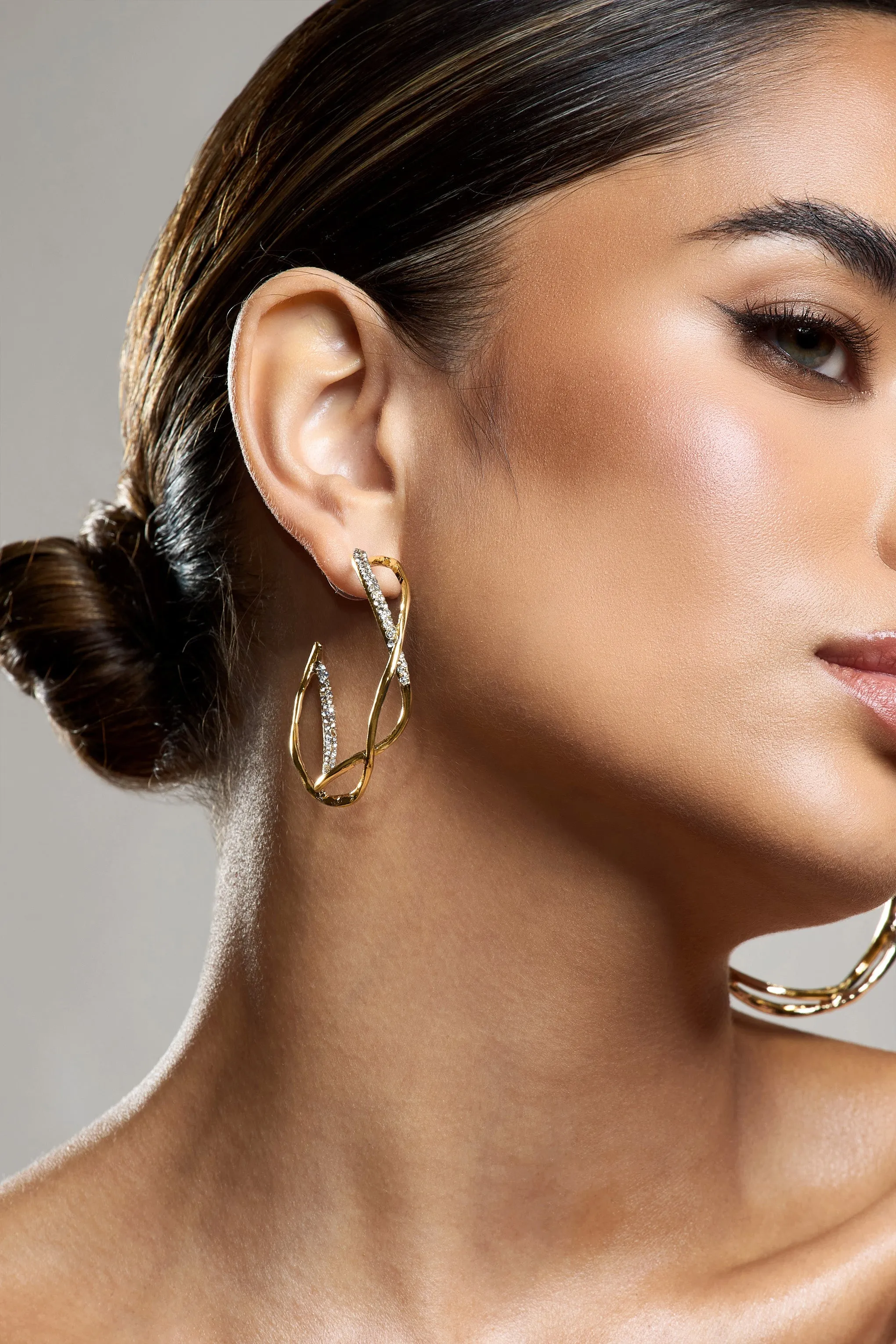 Lova | Gold Diamante Twisted Hoop Earrings sold by Club L London product image thumbnail 4