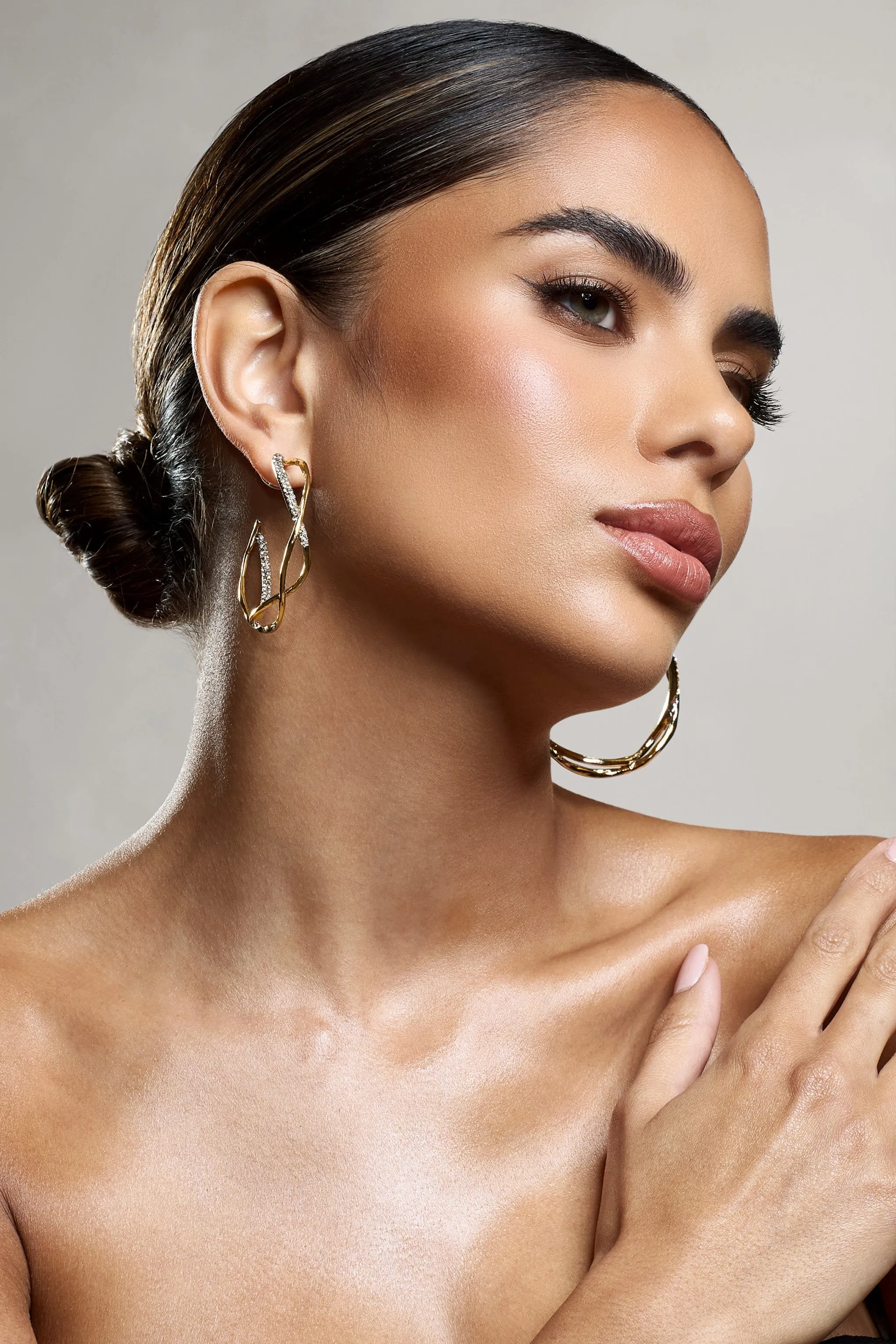 Lova | Gold Diamante Twisted Hoop Earrings sold by Club L London product image thumbnail 3