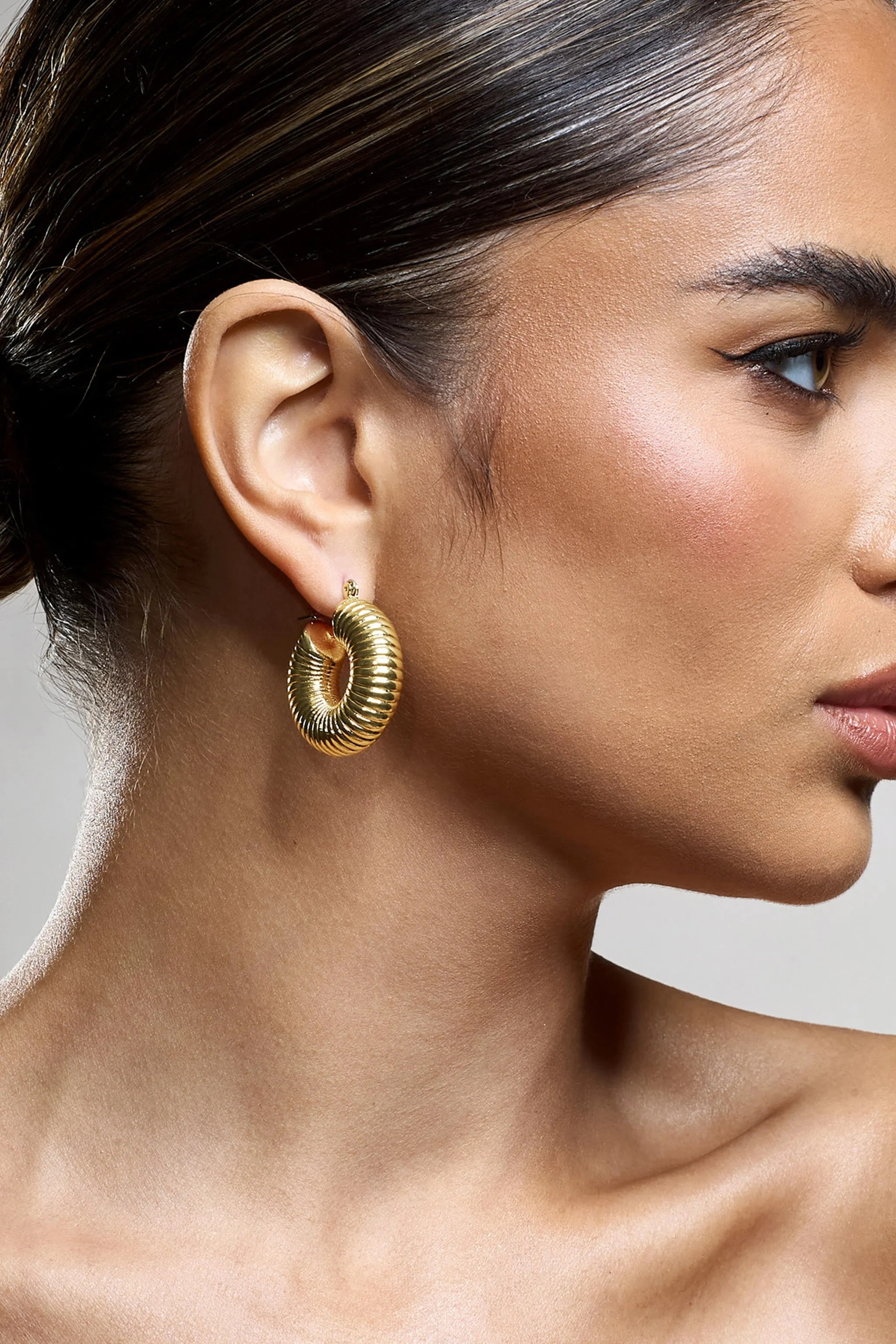 Marceline | Gold Ribbed Chunky Hoop Earrings sold by Club L London product image thumbnail 2
