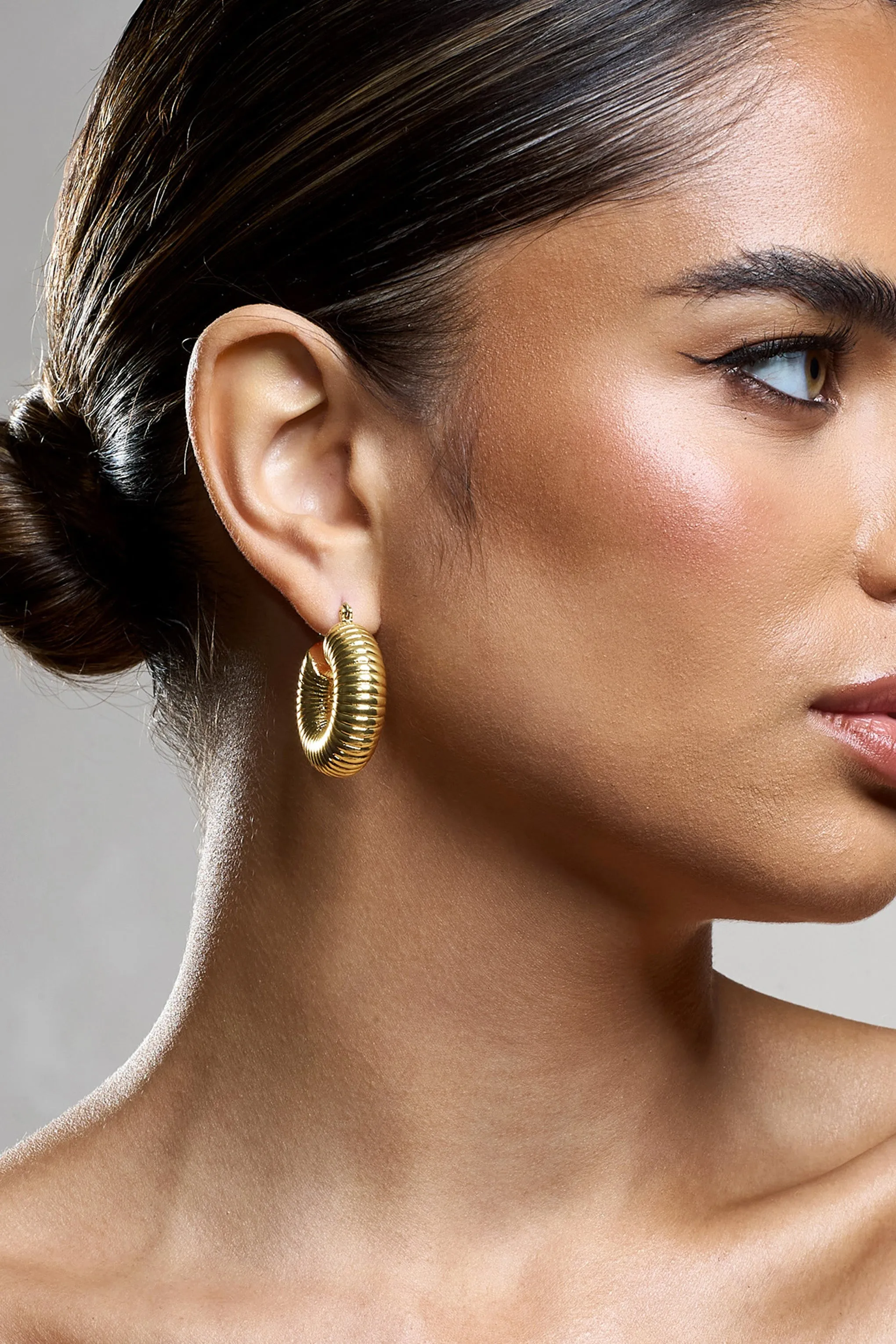 Marceline | Gold Ribbed Chunky Hoop Earrings sold by Club L London