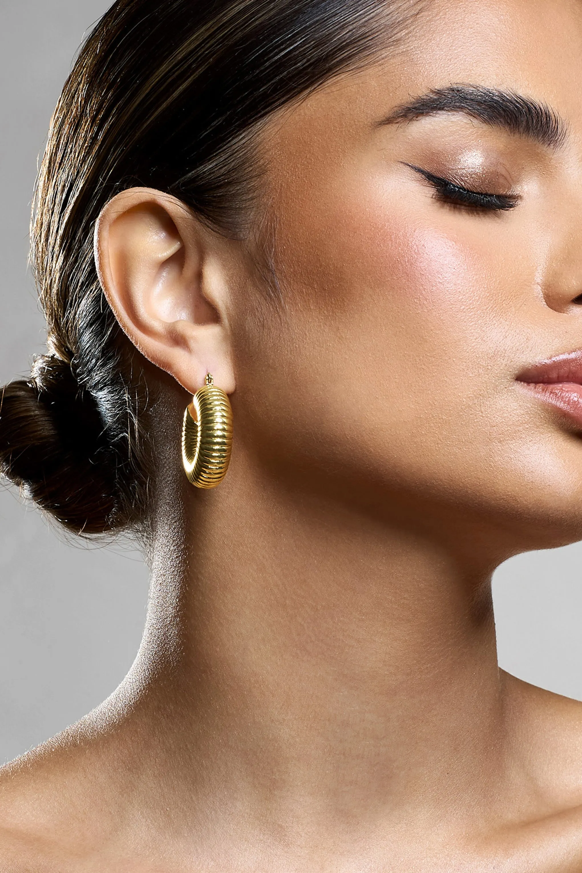 Marceline | Gold Ribbed Chunky Hoop Earrings sold by Club L London product image thumbnail 3