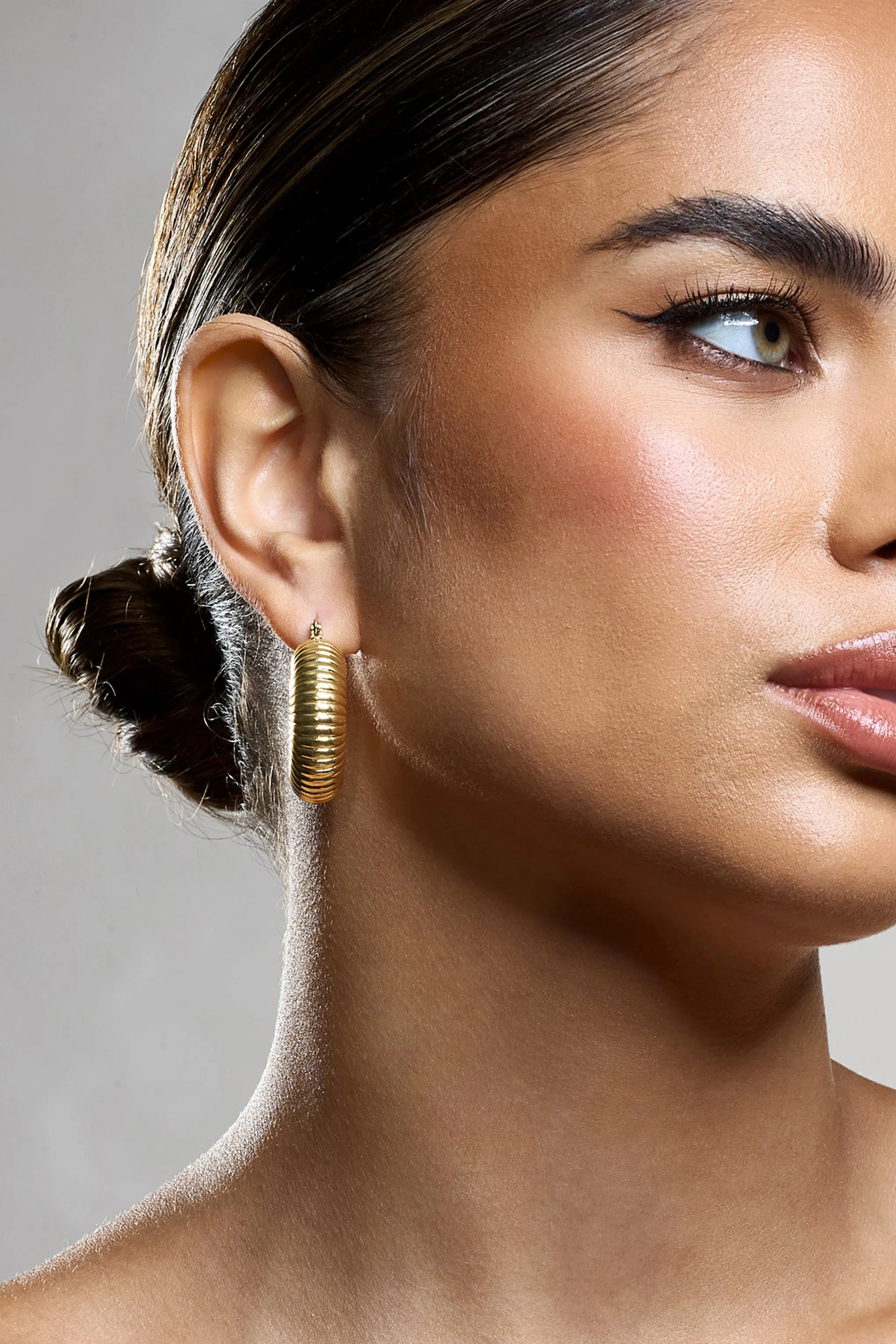 Marceline | Gold Ribbed Chunky Hoop Earrings sold by Club L London product image thumbnail 4
