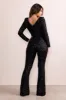 Jolie | Black Sequin Plunge Neck Flared Leg Jumpsuit sold by Club L London