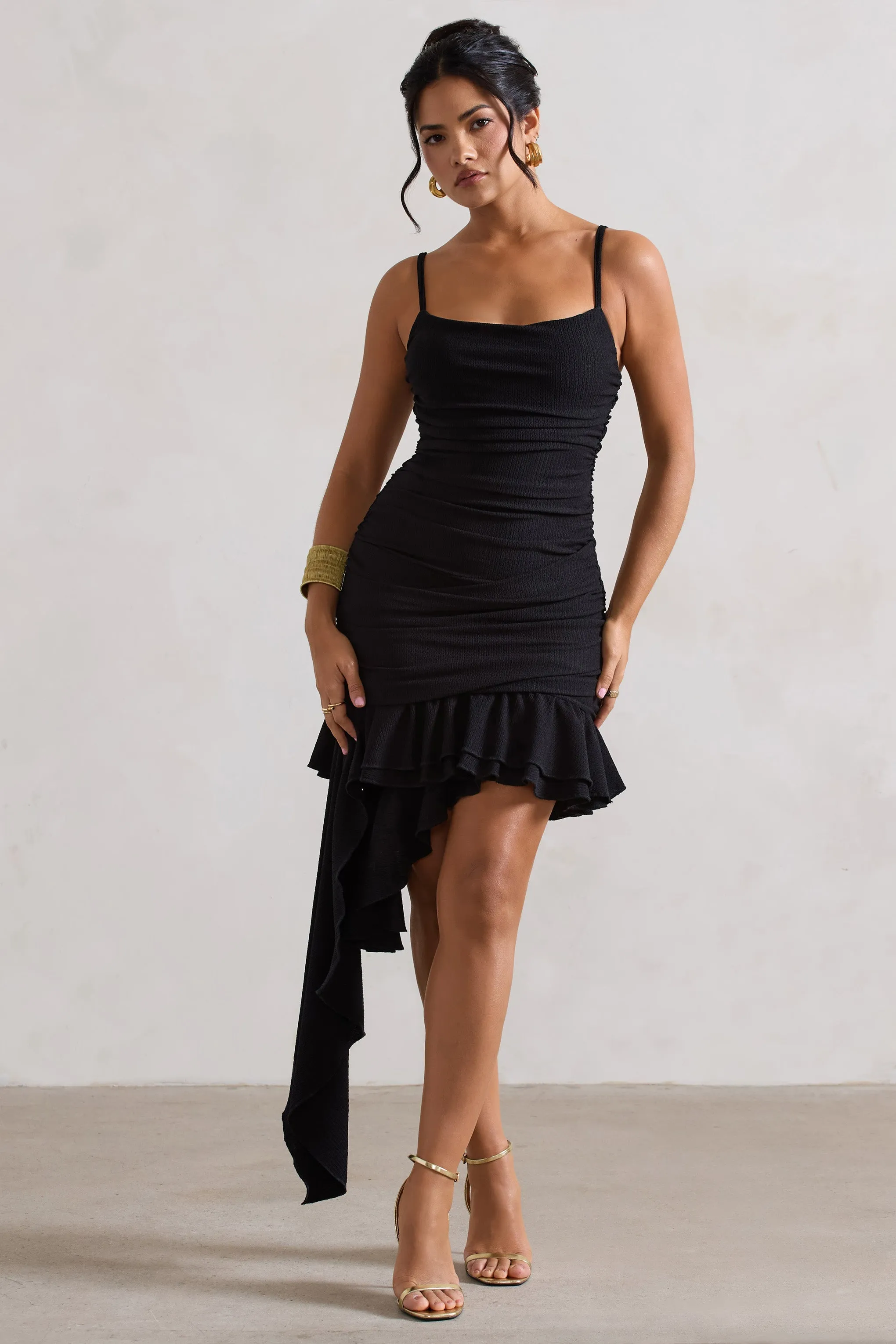 Fleetwood | Black Ruched Mini Dress With Asymmetric Ruffle Hem sold by Club L London