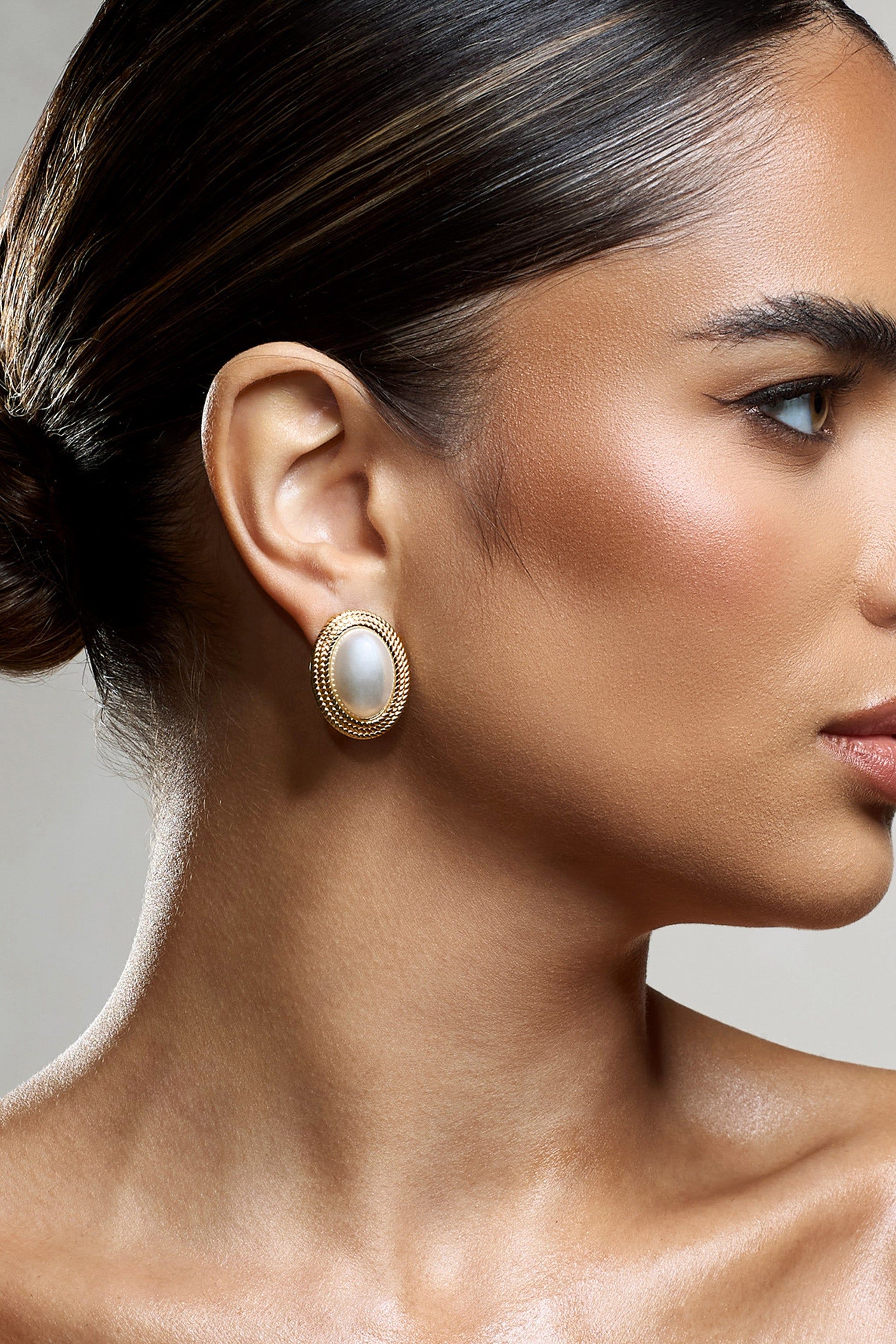 Maeva | Gold Pearl Pendant Earrings sold by Club L London
