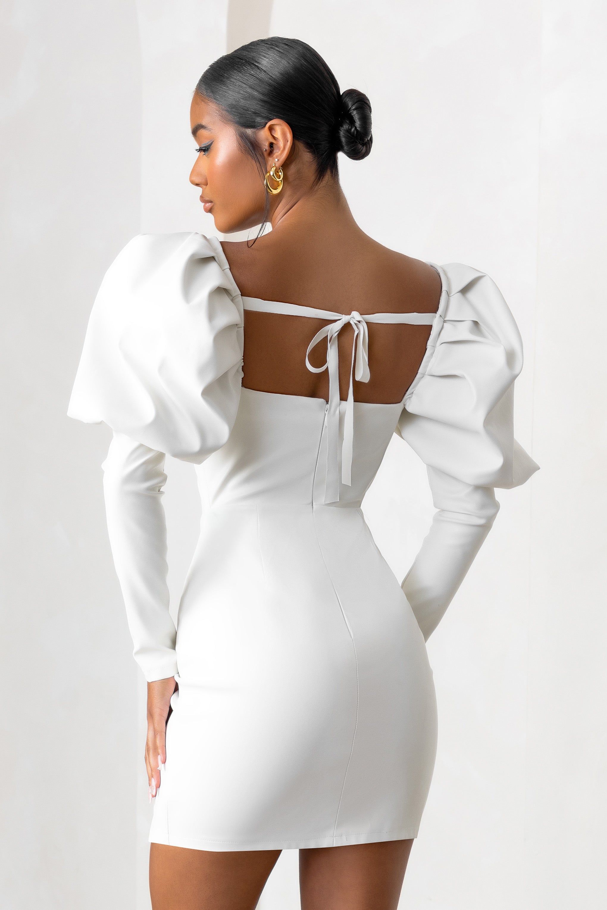 Karyme | Off White Faux Leather Puff Sleeve Mini Dress With Corset Detail sold by Club L London product image thumbnail 2