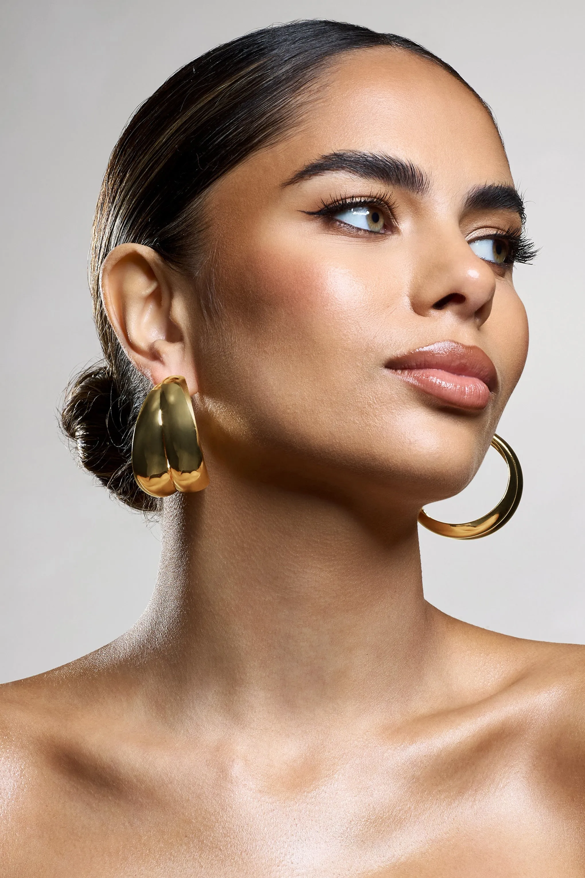 Manuka | Gold Chunky Layered Hoop Earrings sold by Club L London