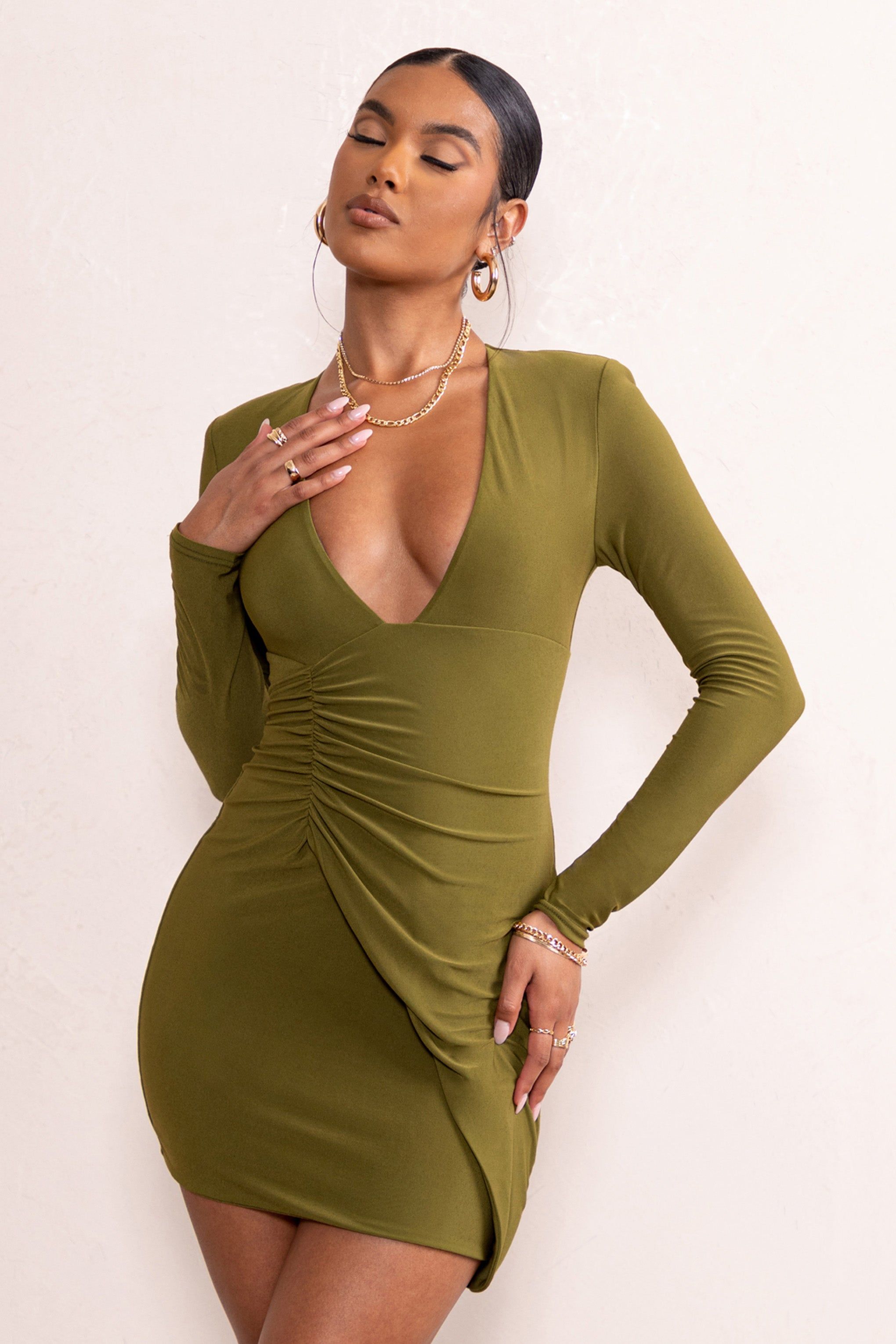 Elora | Khaki Long Sleeved Plunge Neck Ruched Side Mini Dress sold by Club L London