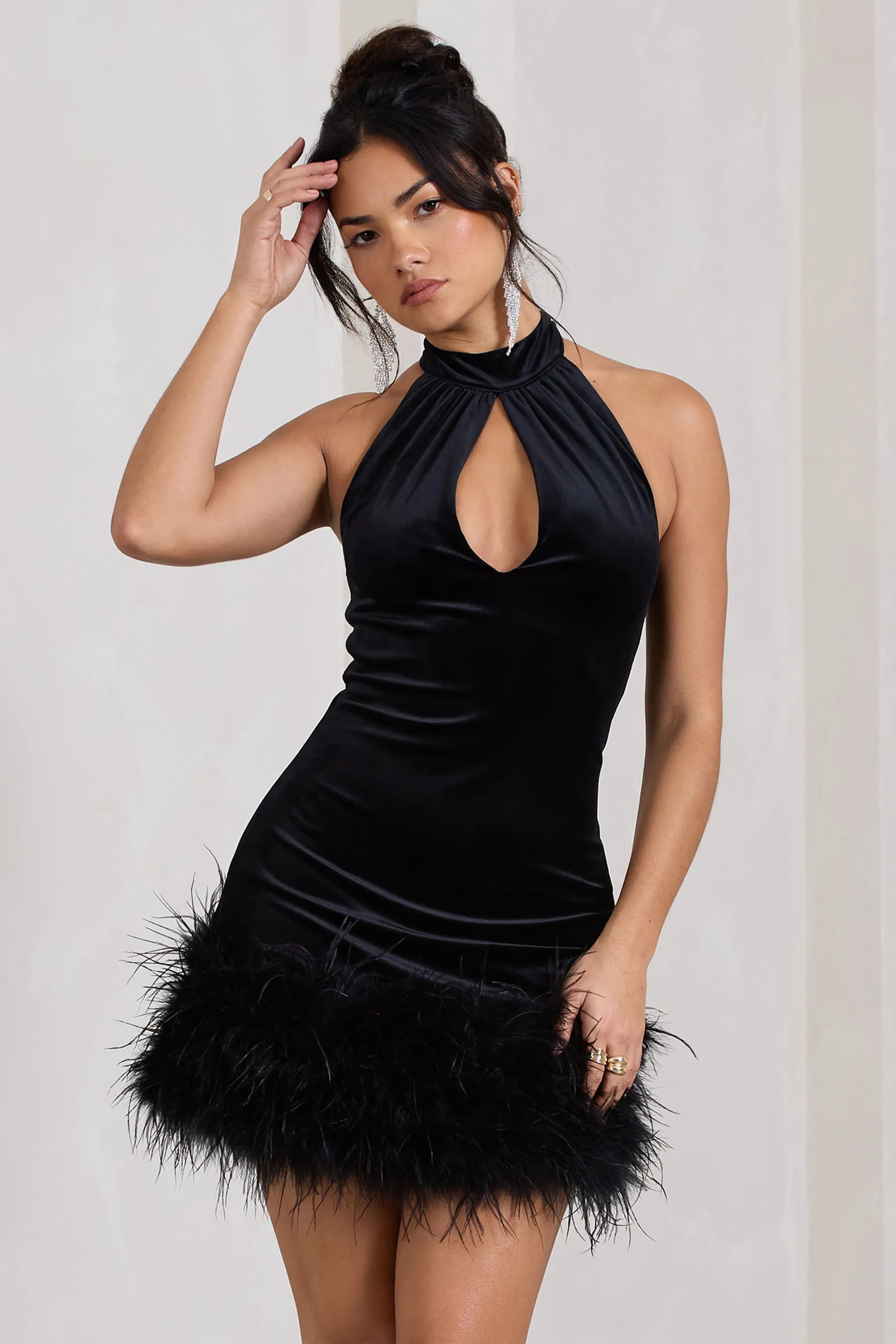 Tillie | Black Velvet High Neck Trapeze Mini Dress With Feather Hem Detail sold by Club L London