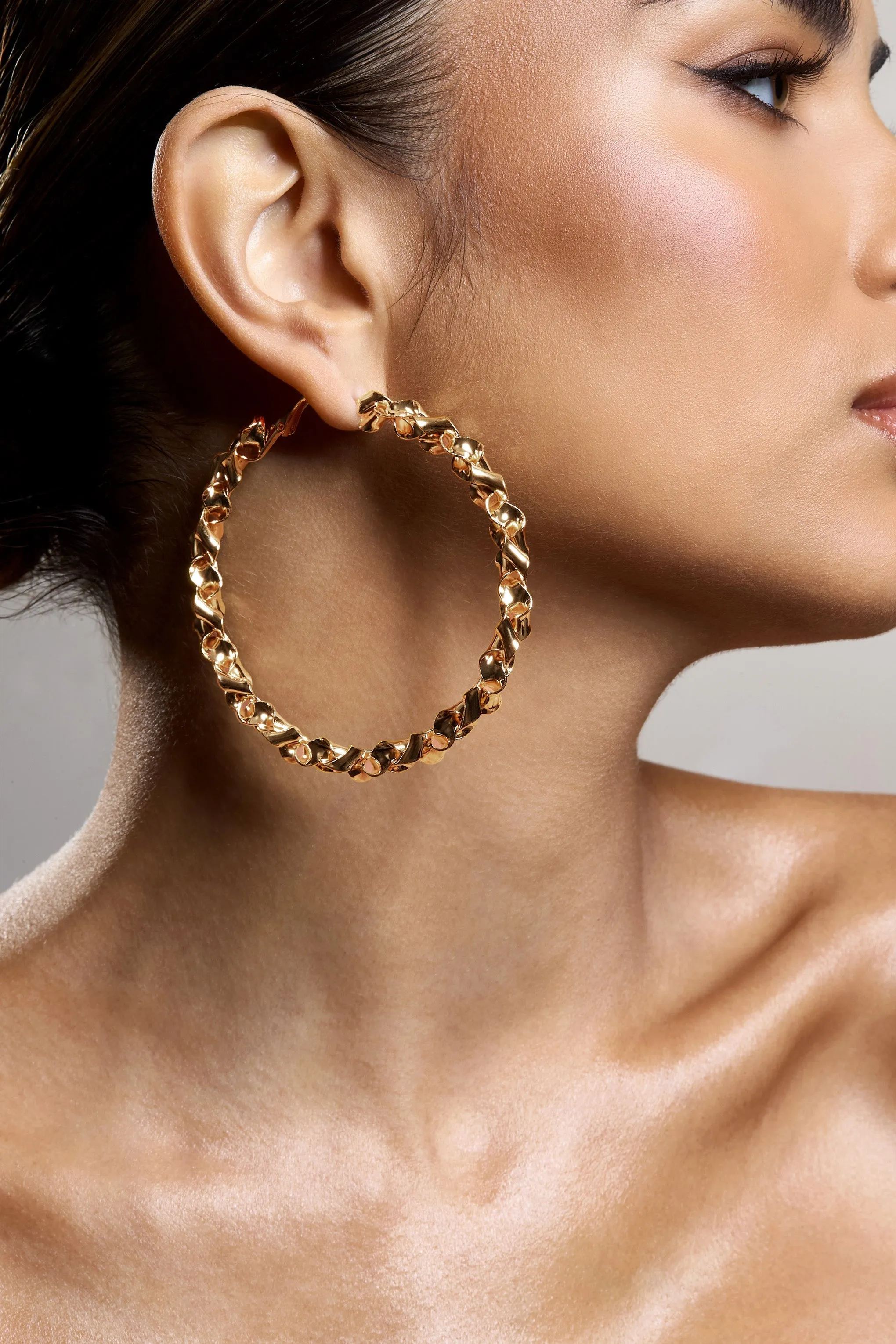 Cecilia | Gold Twisted Hoop Earrings sold by Club L London product image thumbnail 4