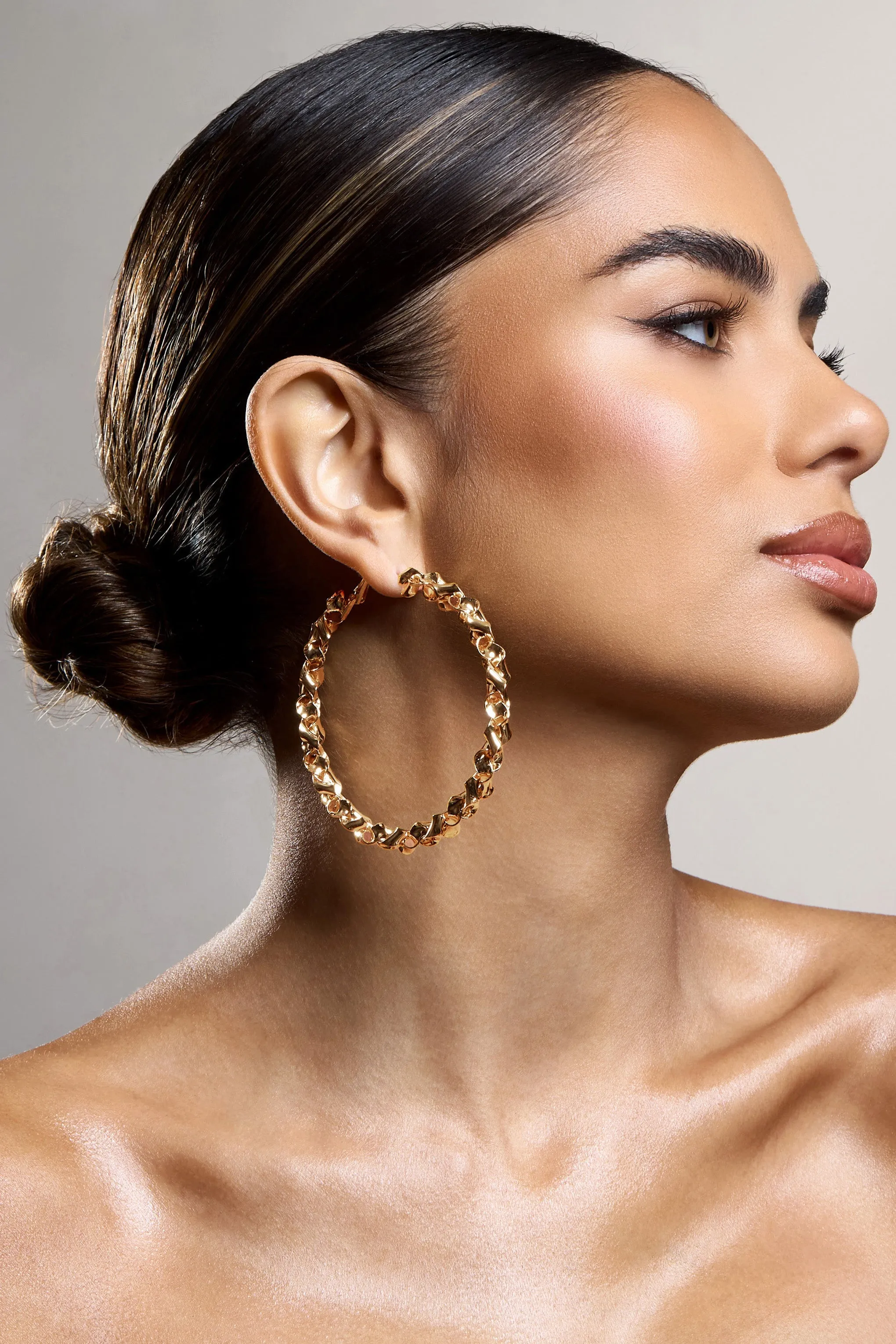 Cecilia | Gold Twisted Hoop Earrings sold by Club L London