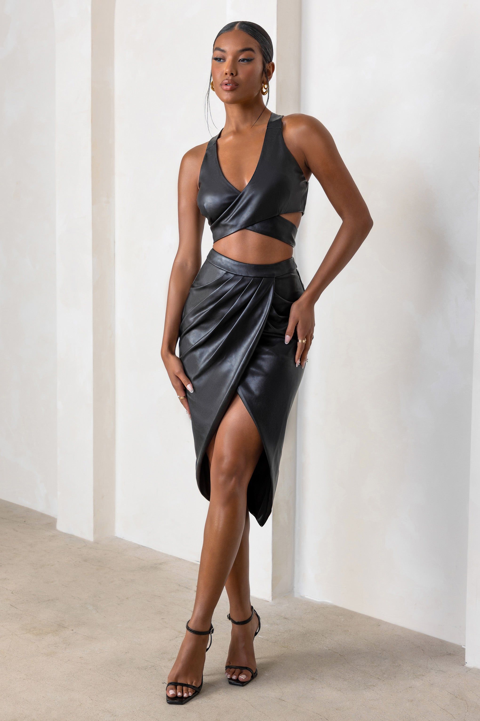 Wished For You | Black Faux Leather High Waist Wrap Front Midi Skirt sold by Club L London