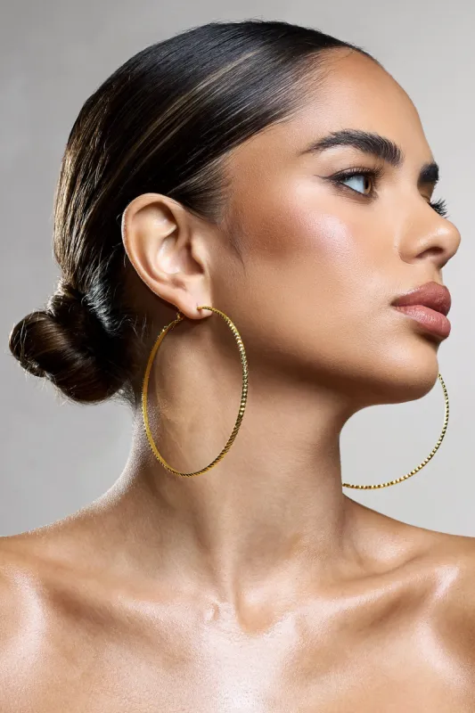 Deia | Gold Ribbed Hoop Earrings sold by Club L London