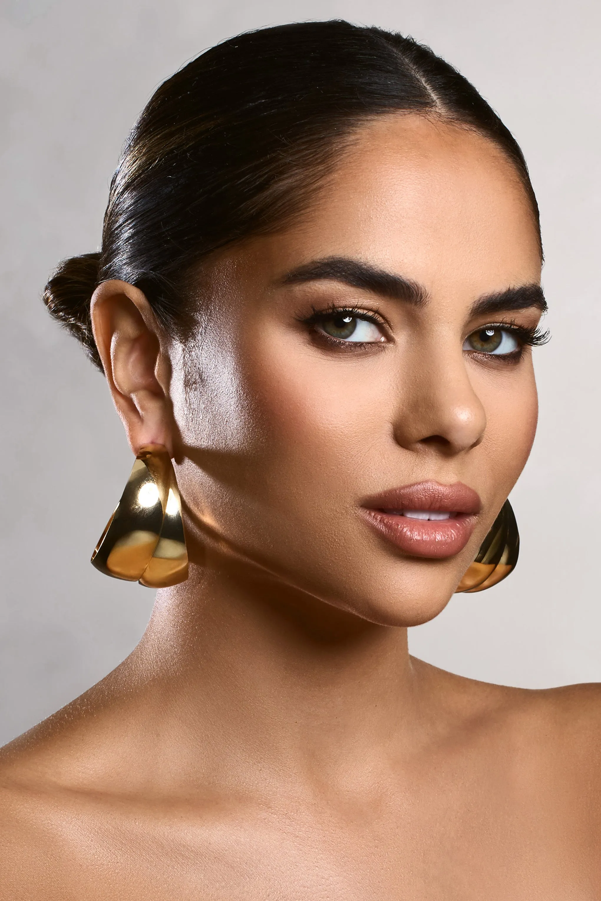 Melania | Gold Chunky Layered Hoop Earrings sold by Club L London