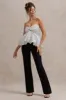 Divina | White & Black Polka Dot Strapless Ruffled Jumpsuit sold by Club L London