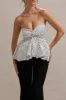 Divina | White & Black Polka Dot Strapless Ruffled Jumpsuit sold by Club L London