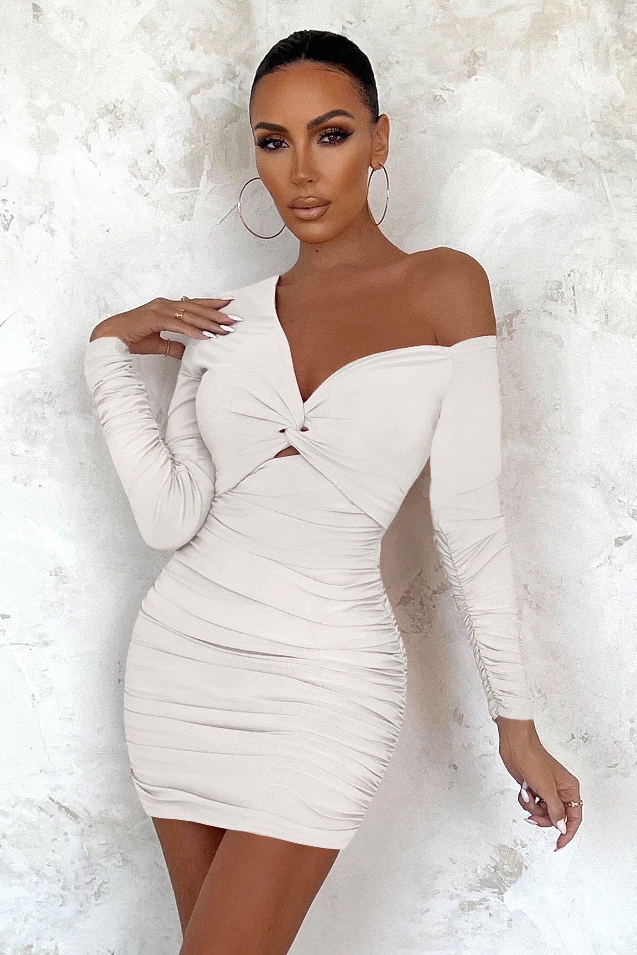 Repeat After Me | Off White Asymmetrical Long Sleeve Twist Front Ruched Mini Dress sold by Club L London