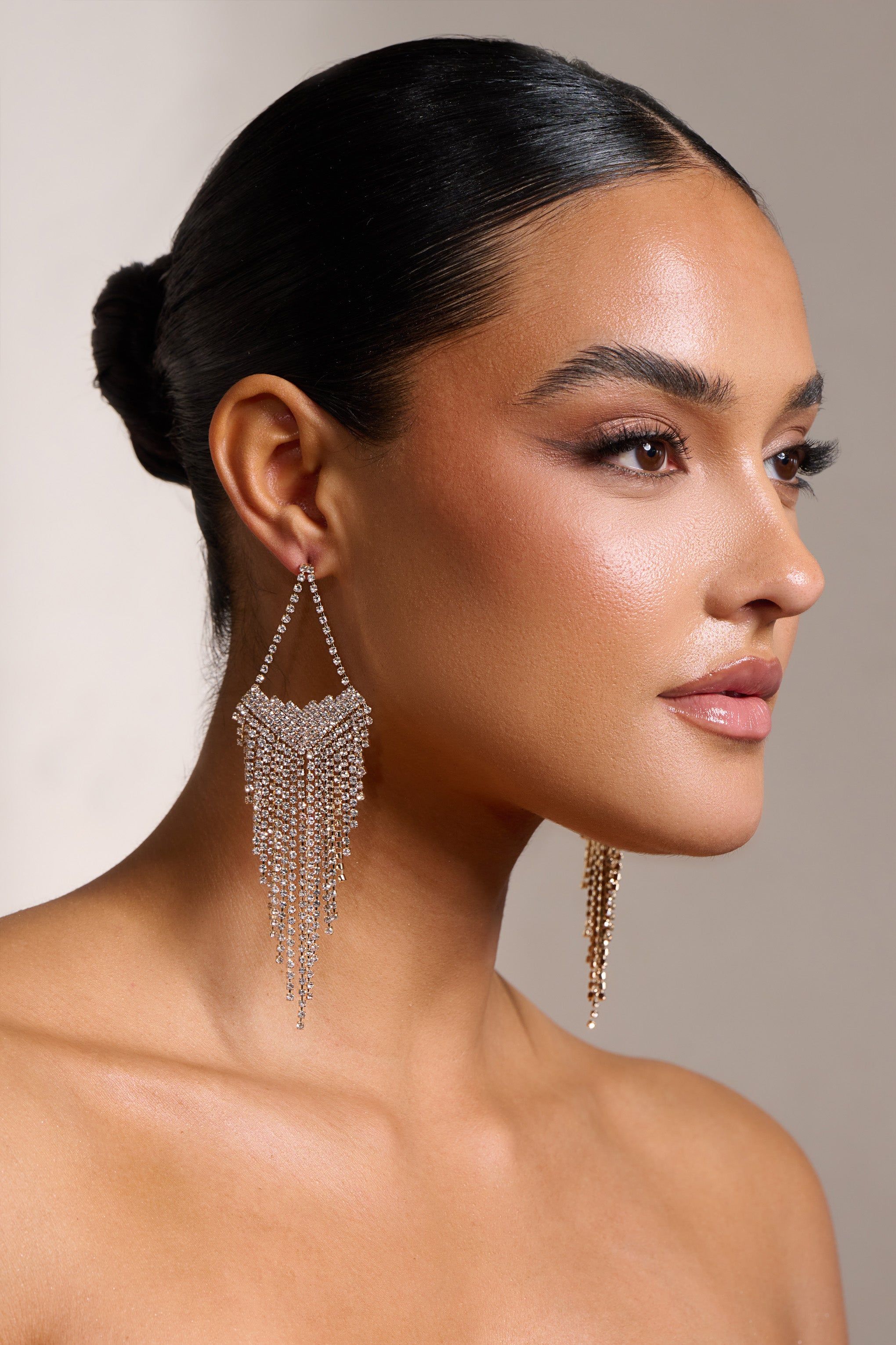 Cassandra | Gold Diamante Tassel Drop Earrings sold by Club L London