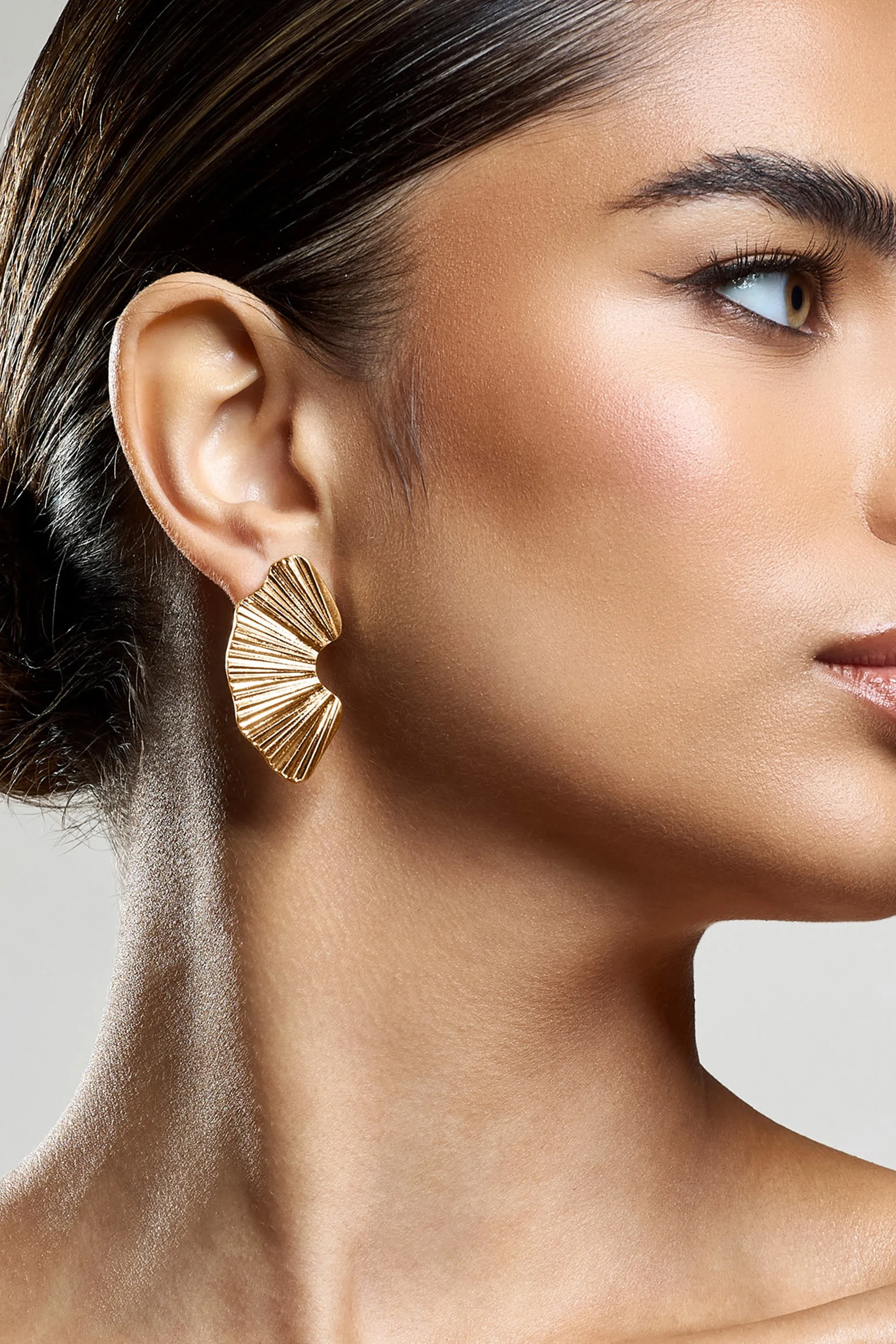 Lenten | Gold Abstract Ribbed Earrings sold by Club L London