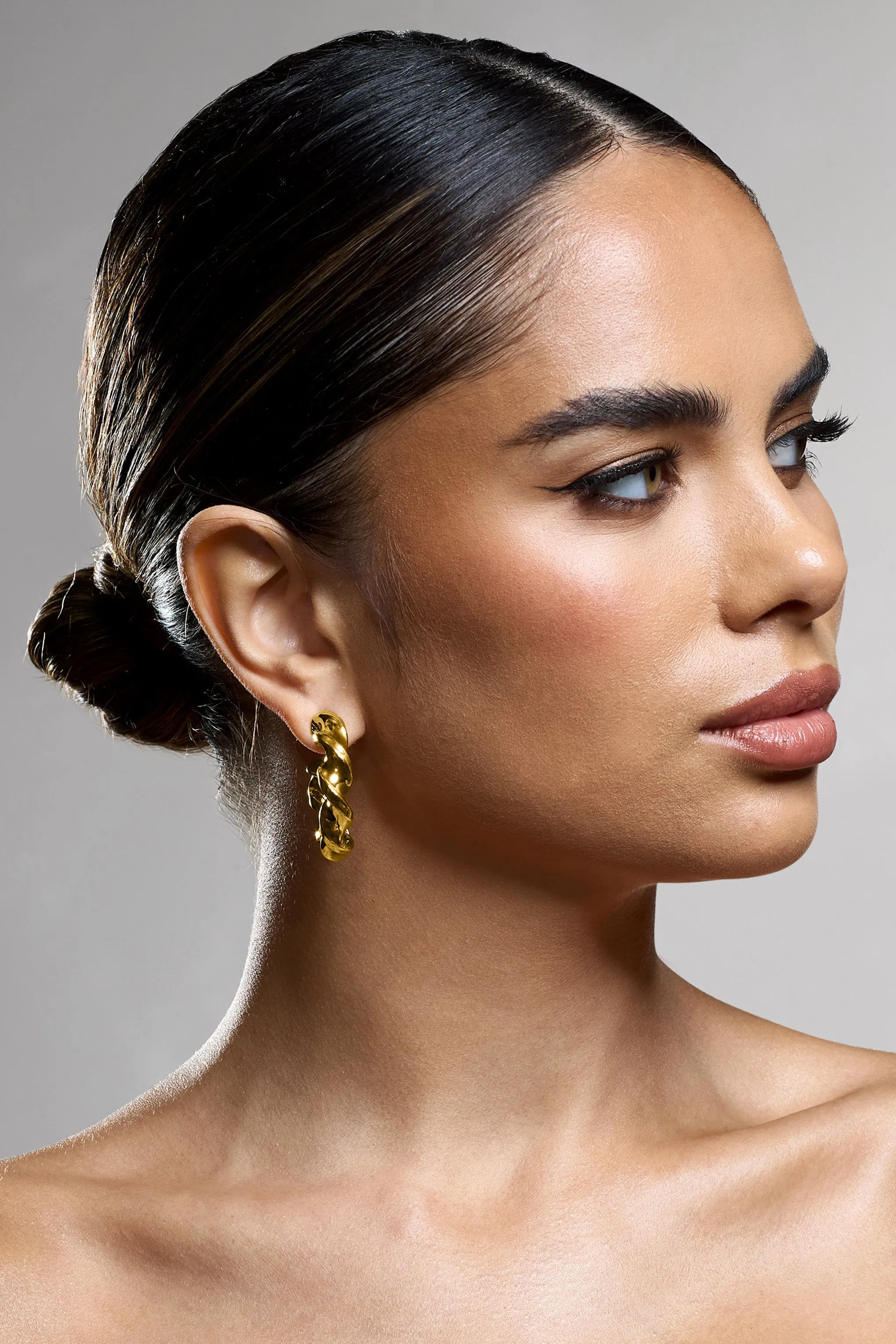 Greta | Gold Twisted Hoop Earrings sold by Club L London product image thumbnail 3