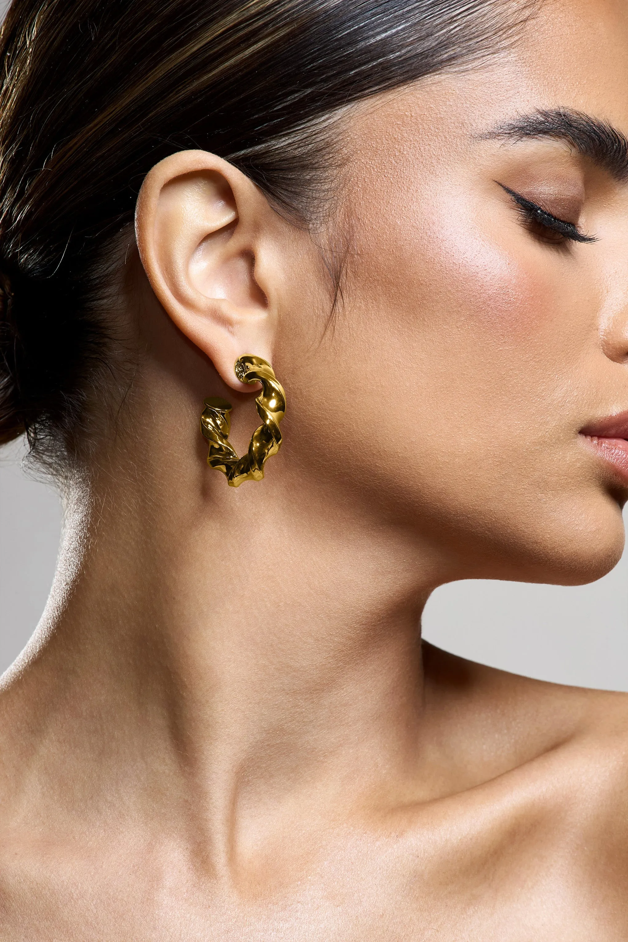 Greta | Gold Twisted Hoop Earrings sold by Club L London product image thumbnail 2