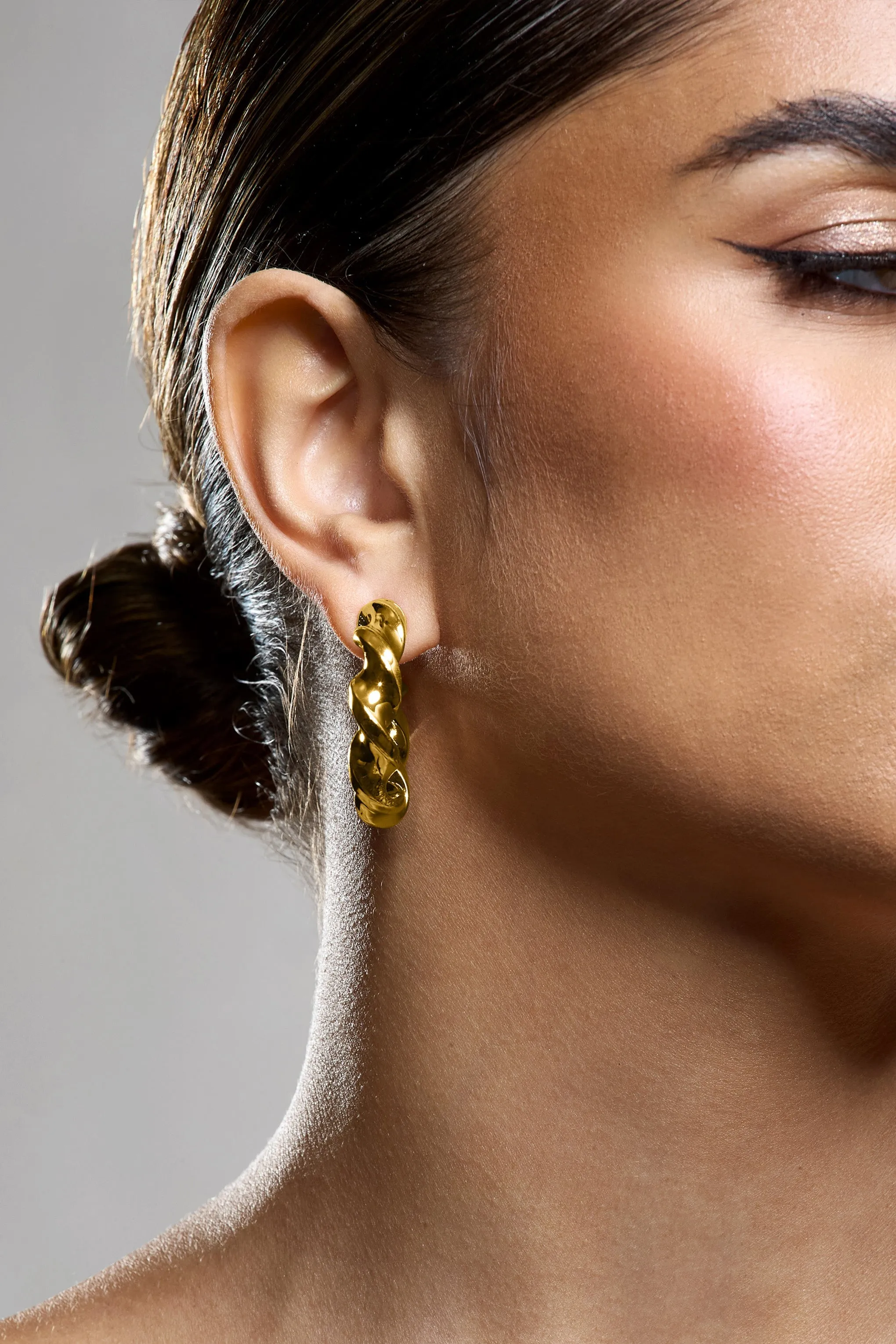 Greta | Gold Twisted Hoop Earrings sold by Club L London product image thumbnail 5