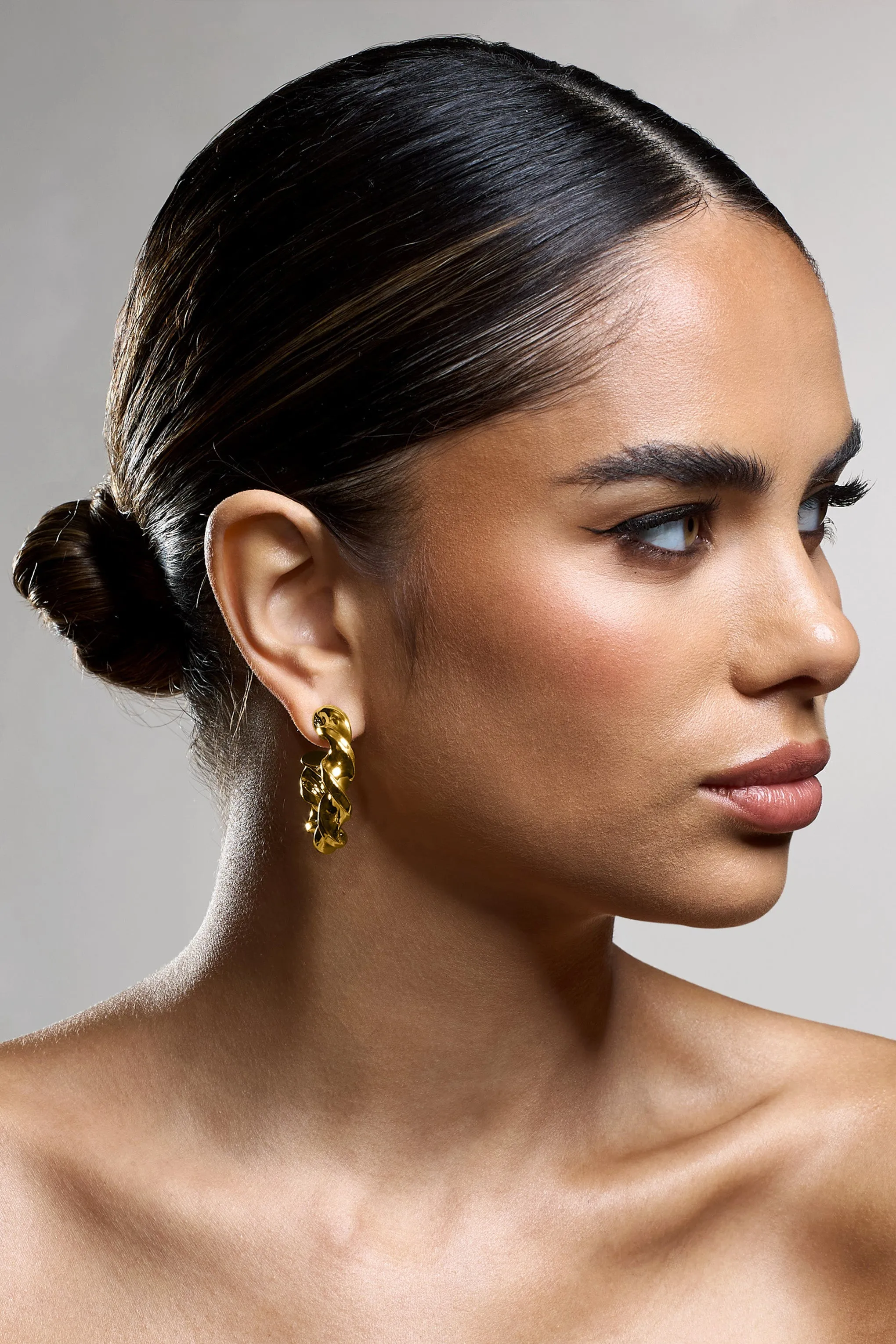 Greta | Gold Twisted Hoop Earrings sold by Club L London product image thumbnail 4