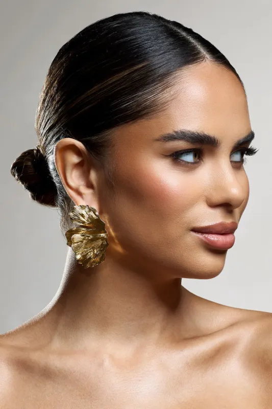 Banyan | Gold Abstract Statement Leaf Earrings sold by Club L London