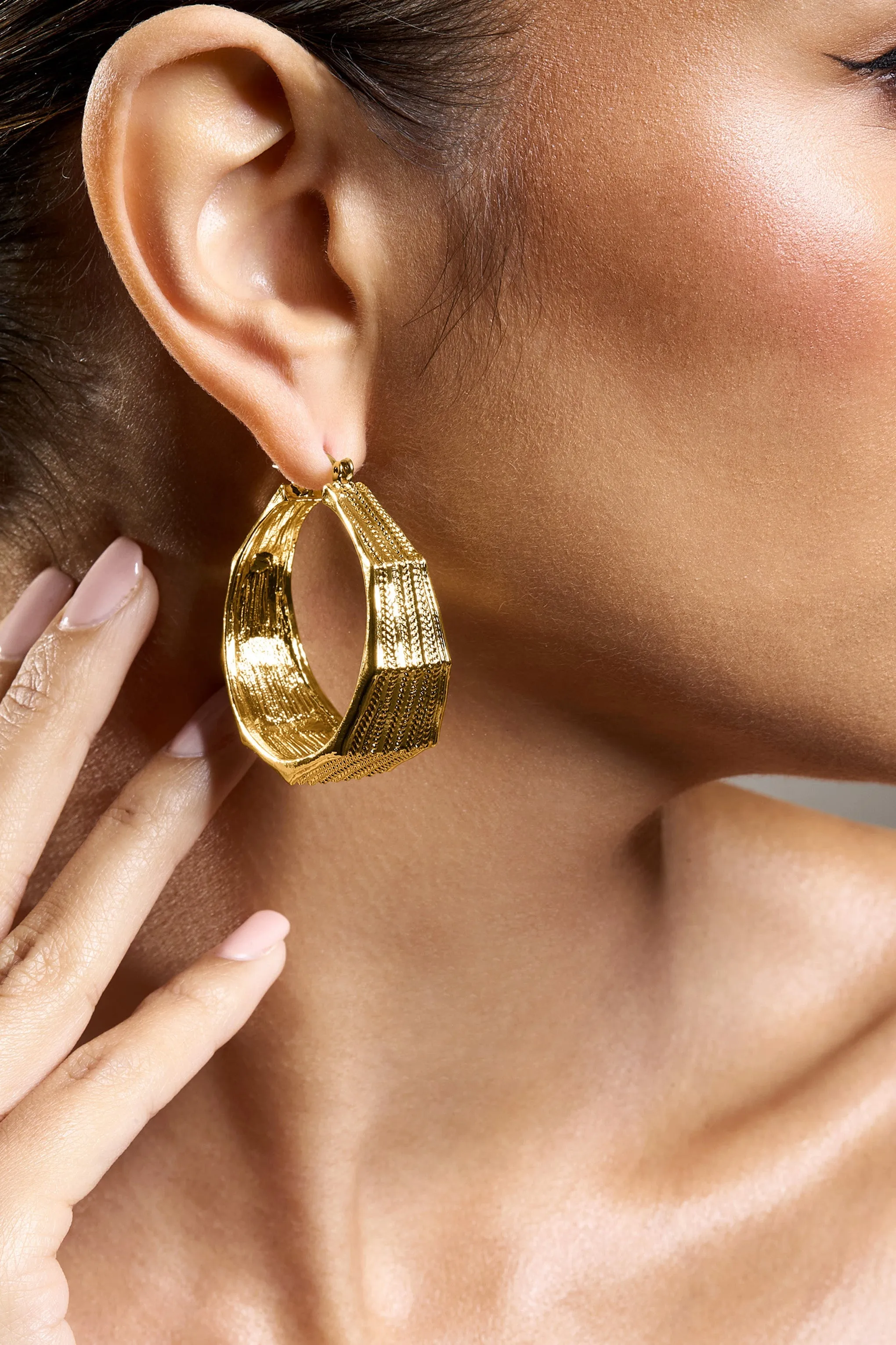 Meg | Gold Ribbed Hoop Earrings sold by Club L London product image thumbnail 5