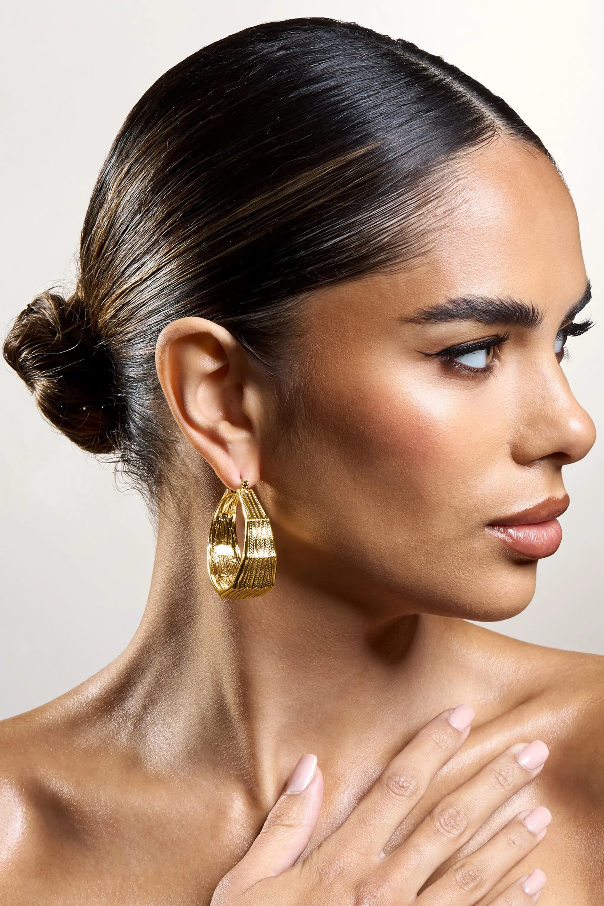 Meg | Gold Ribbed Hoop Earrings sold by Club L London product image thumbnail 4