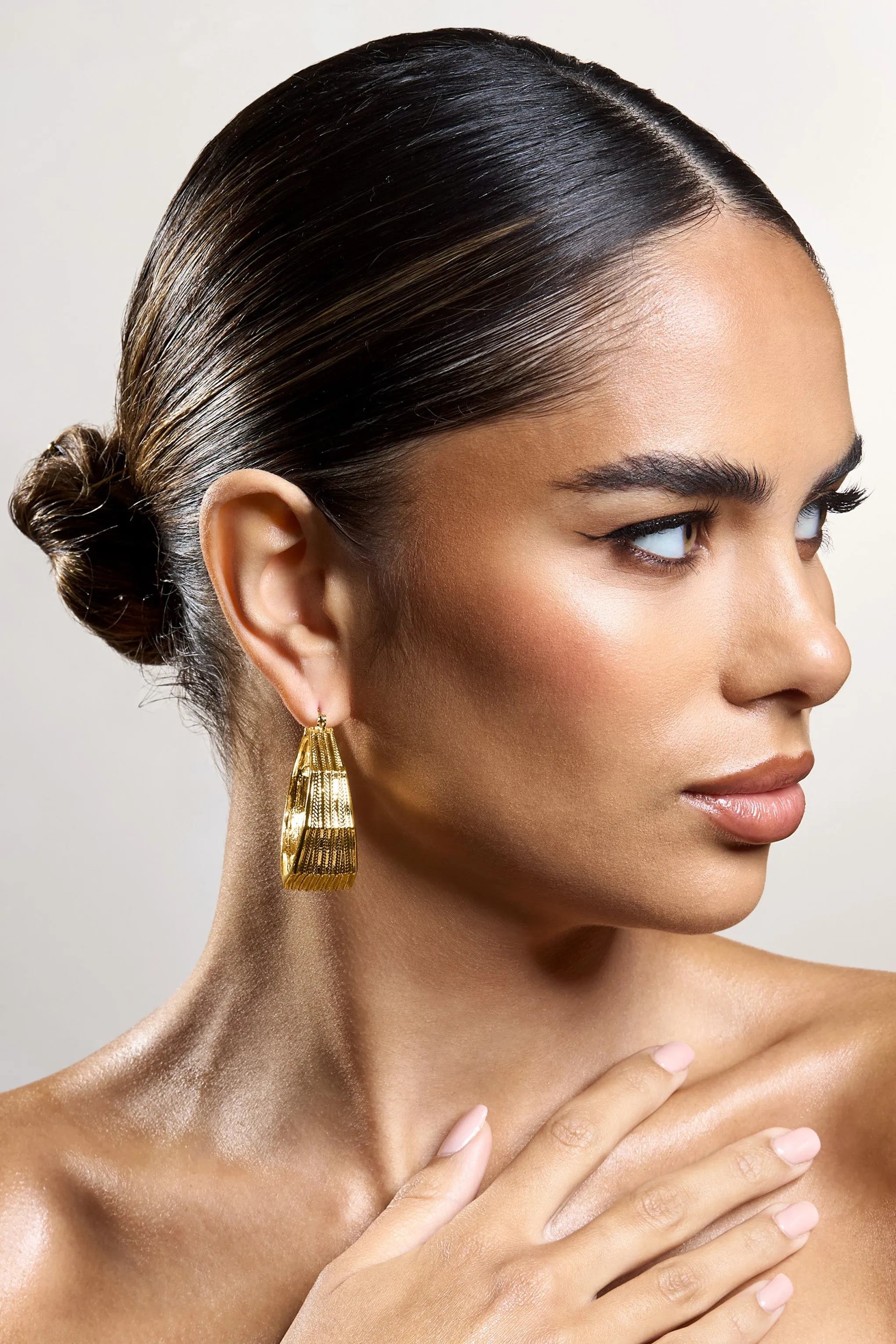 Meg | Gold Ribbed Hoop Earrings sold by Club L London