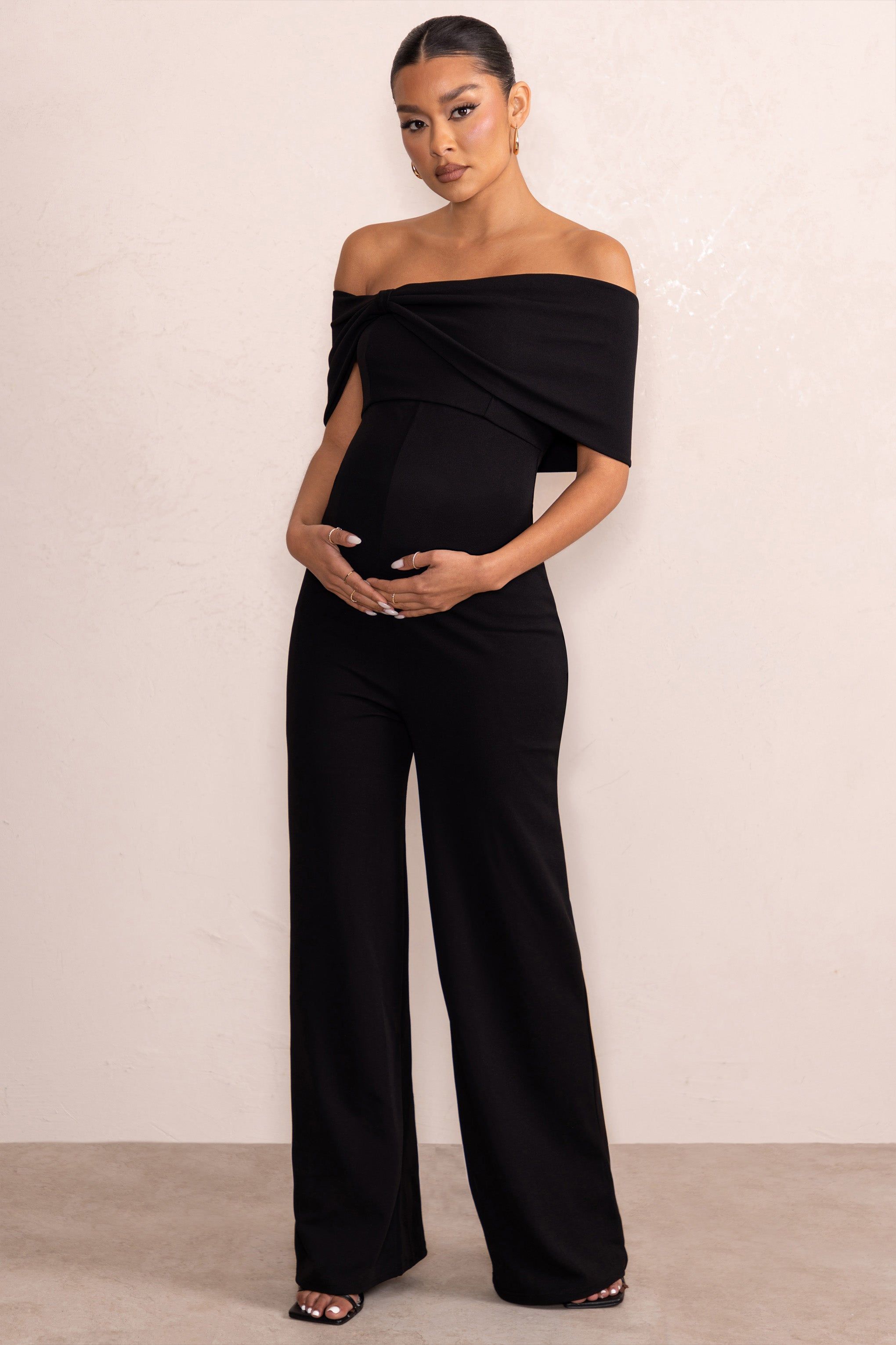 Meave | Black Bardot Bow Maternity Jumpsuit sold by Club L London