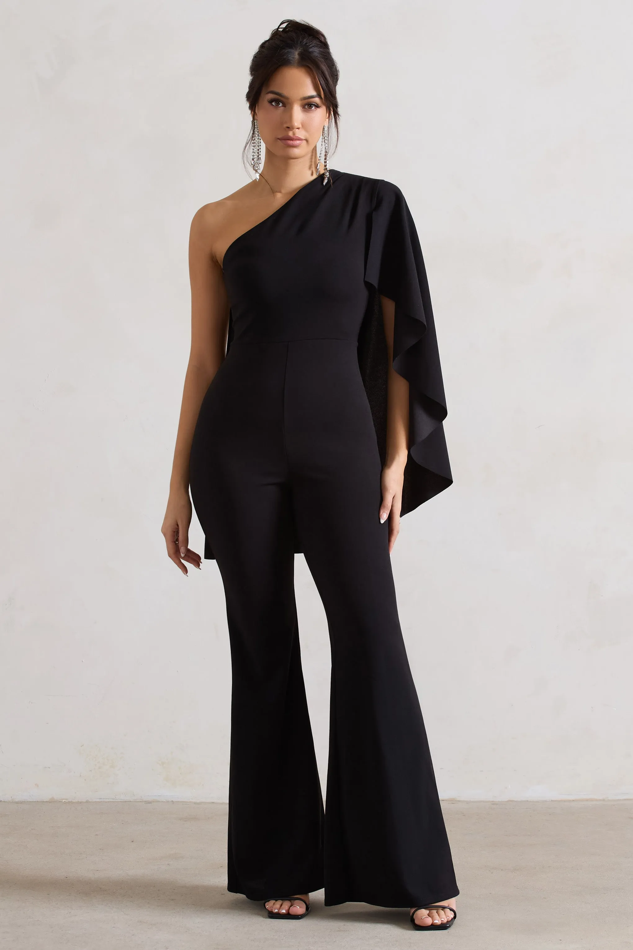 Pristine | Black One Shoulder Cape Sleeve Flared-Leg Jumpsuit sold by Club L London