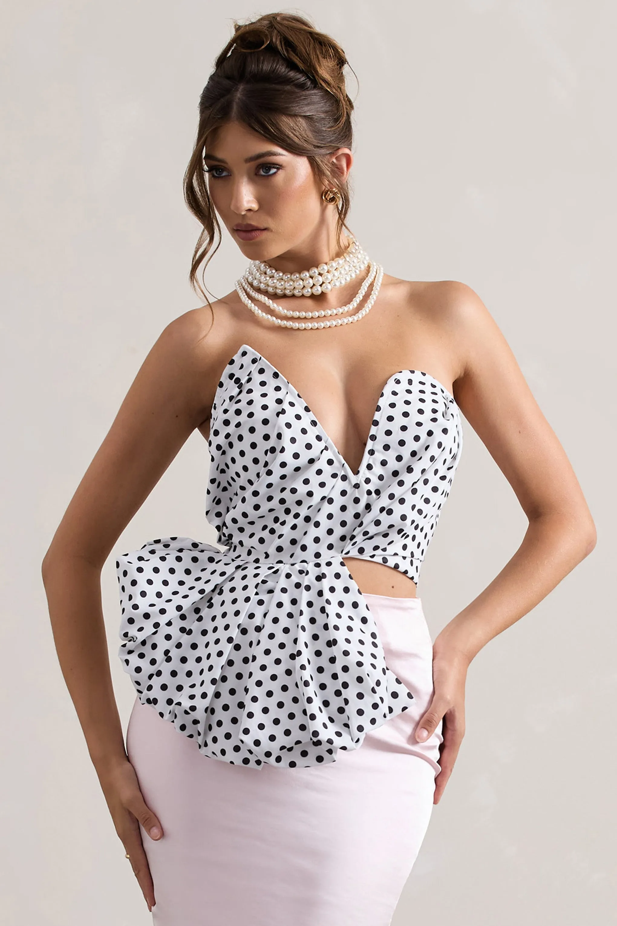 Haute | Cream Polka Dot Asymmetric Plunge-Neck Corset With Ruffle sold by Club L London