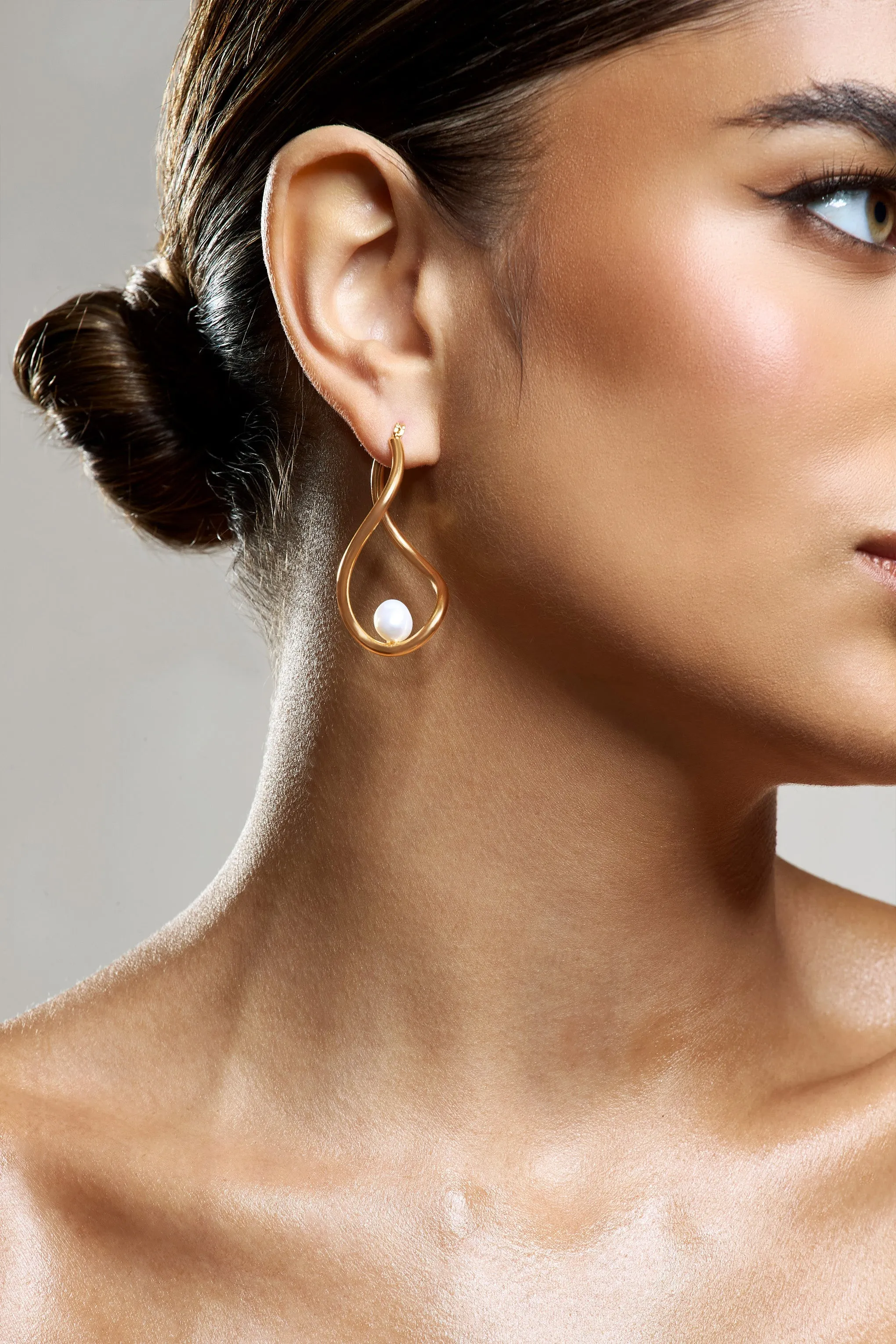 Louise | Gold Pearl Twisted Hoop Earrings sold by Club L London product image thumbnail 4