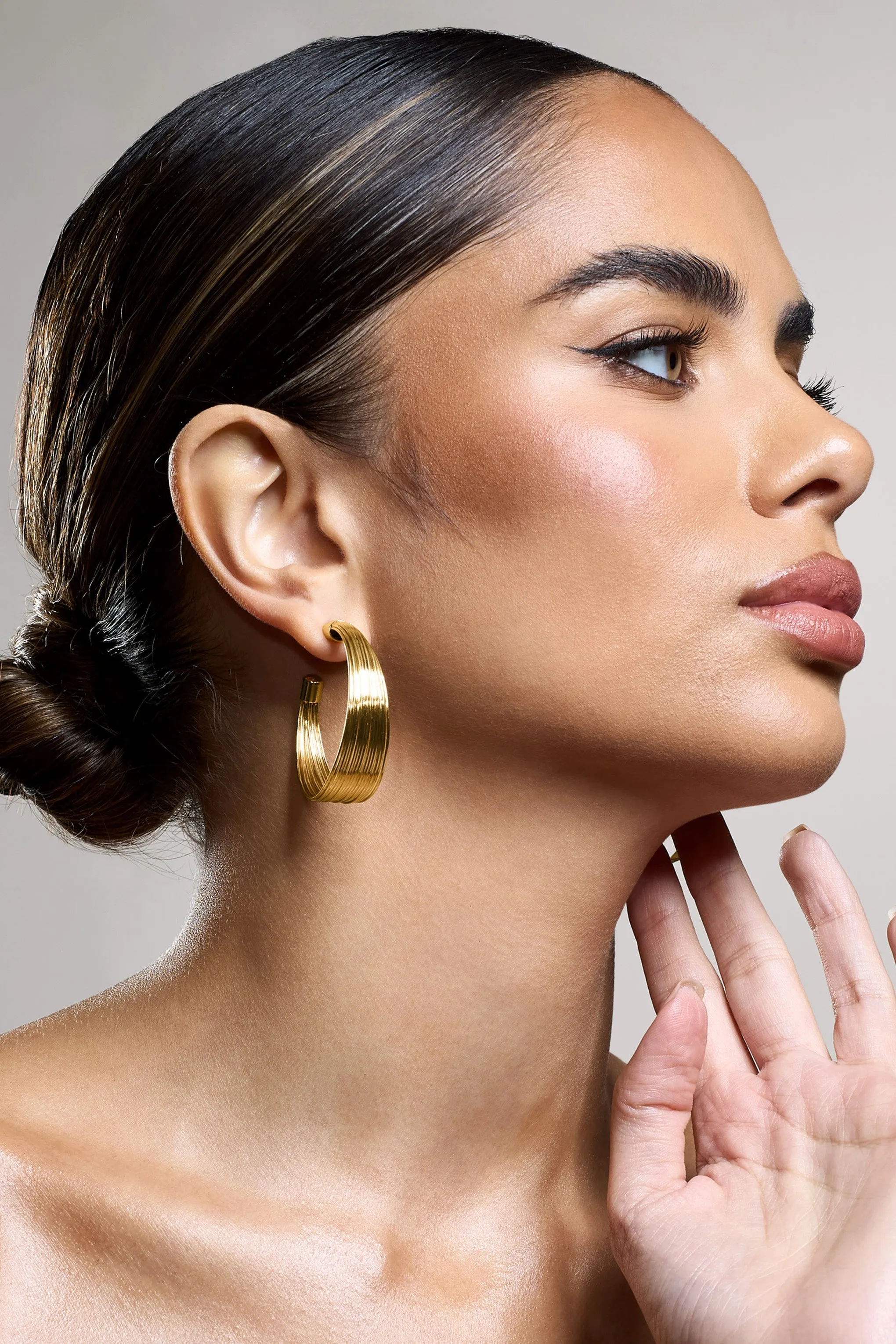 Stori | Gold Layered Hoop Earrings sold by Club L London product image thumbnail 4